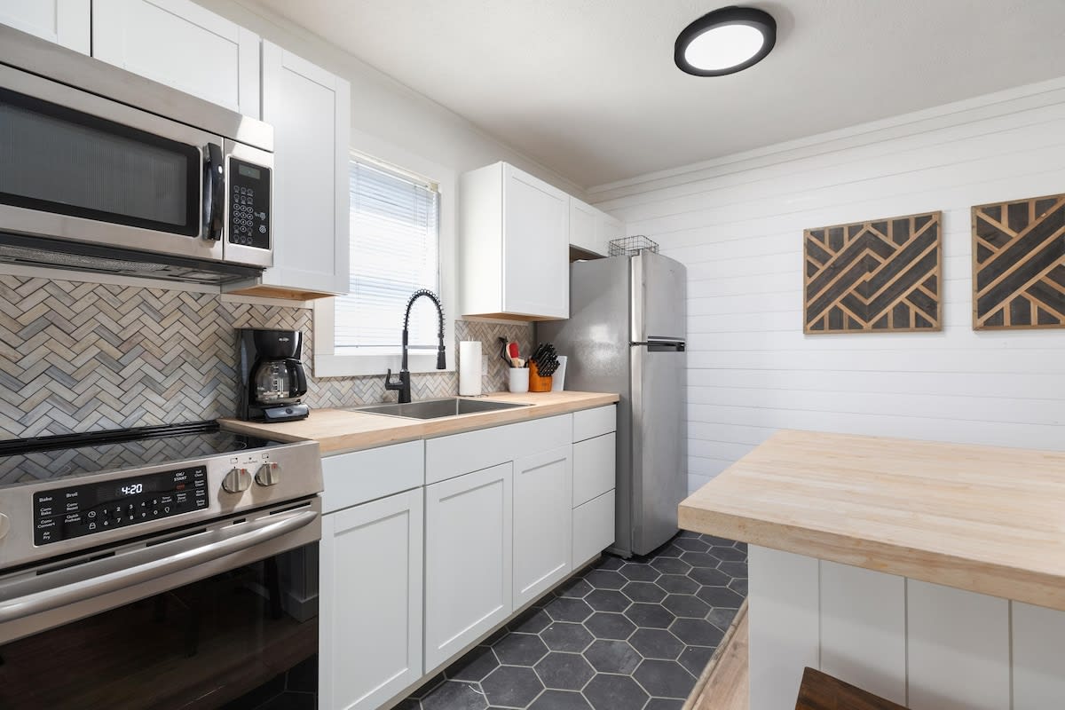 Kitchen stocked with all your basic cookware and utensils