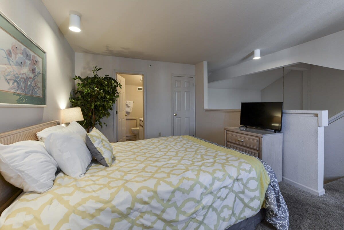 Loft bedroom with attached bathrooom
