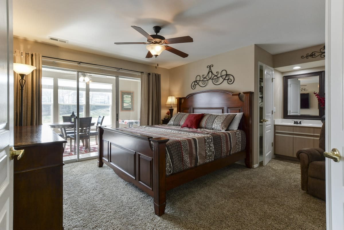 Primary King bedroom - with walkout access to enclosed porch