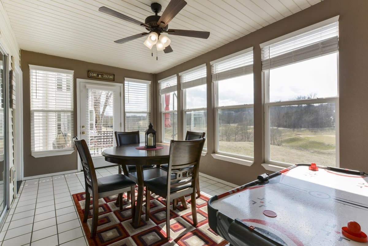 Enclosed porch overlooking golf course