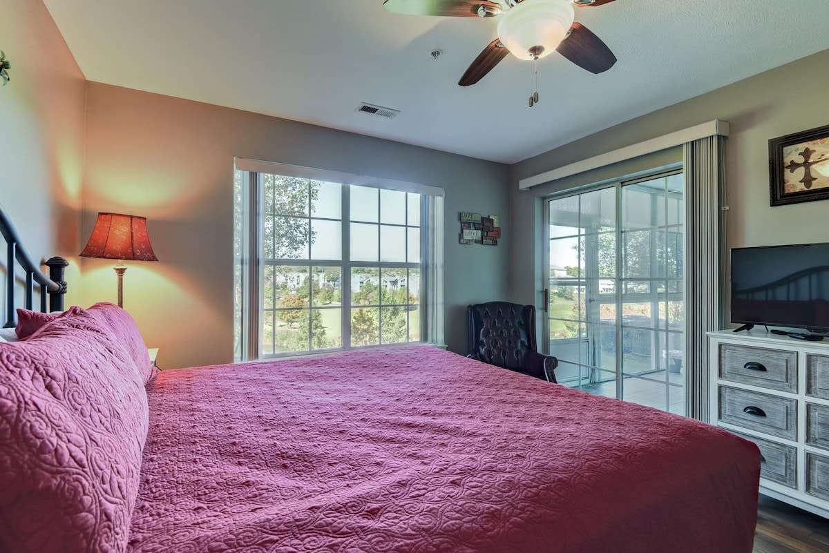 King bedroom with walk out access to back enclosed patio