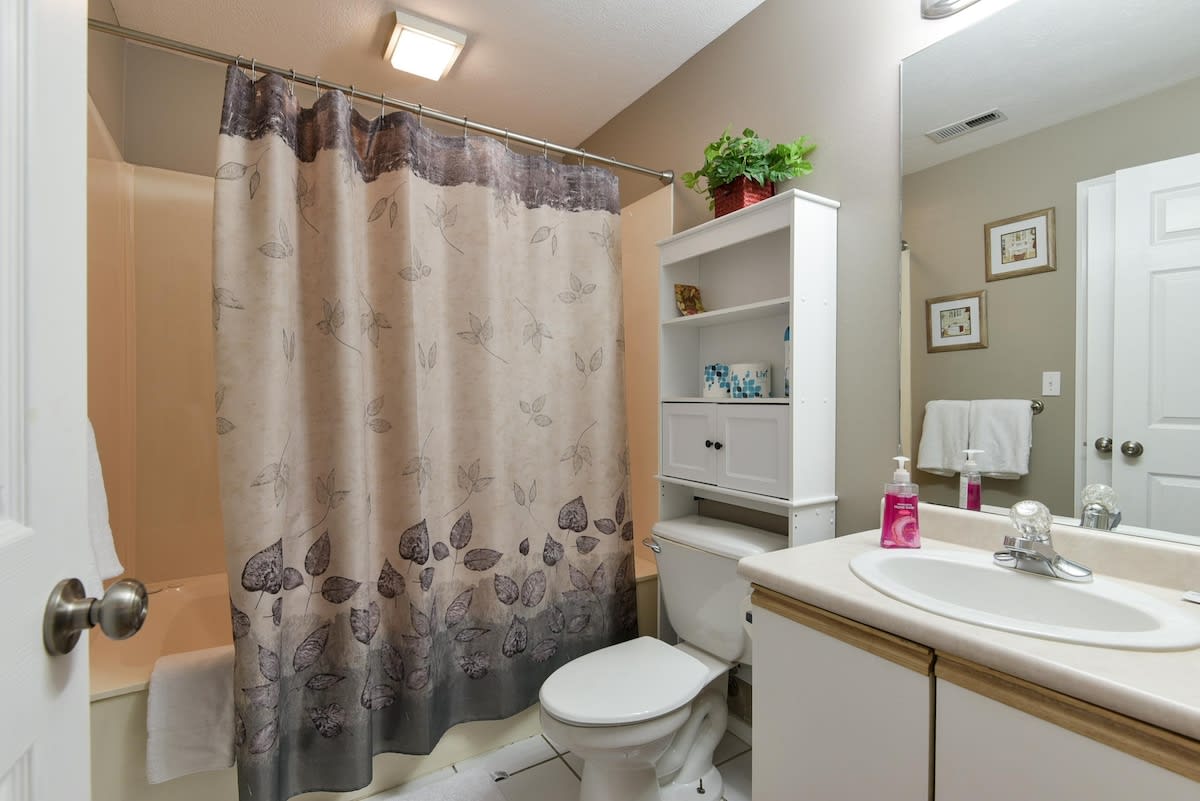 Main guest bathroom w/ secondary door that attaches it to King bedroom.