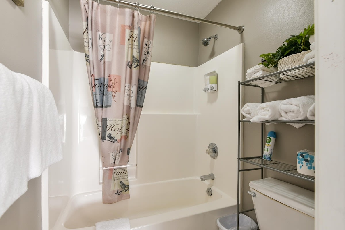 Shower/Tub combo attached to double queen room.