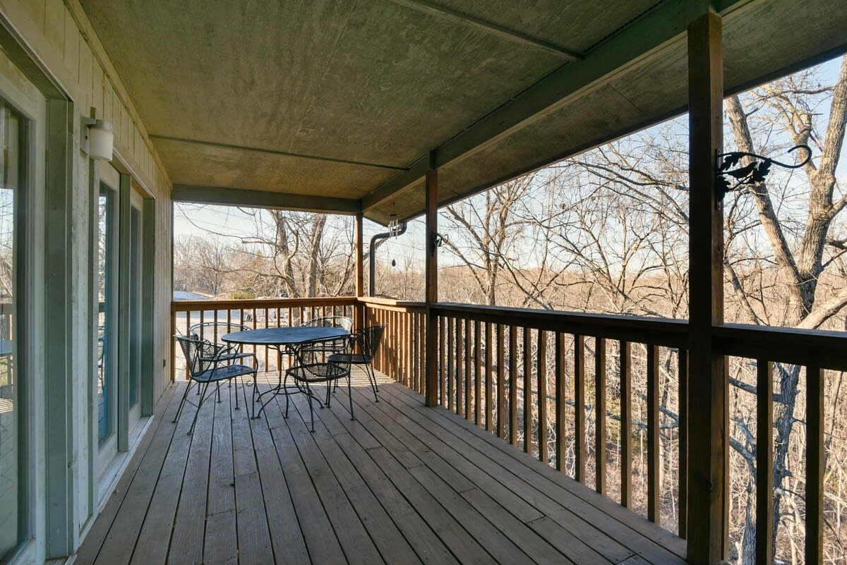 Private back deck overlooking wooded area