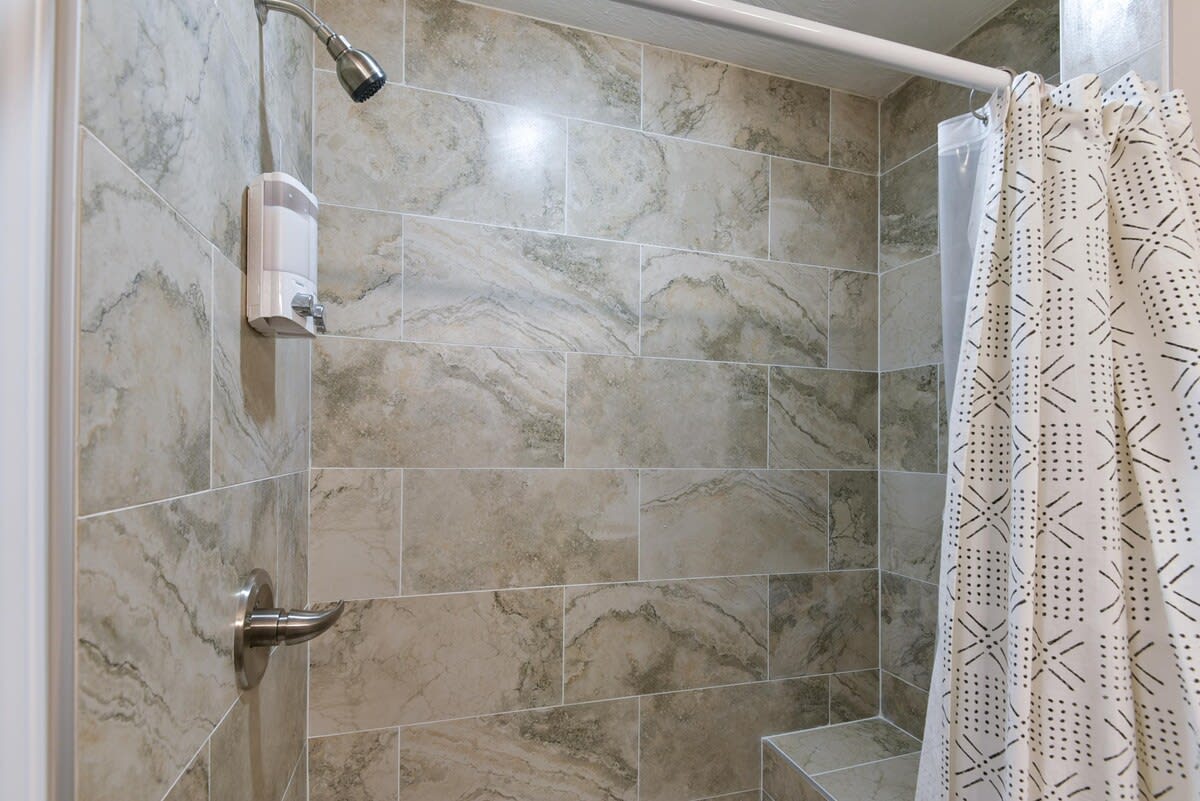 Primary bedroom bathroom - walkin shower with bench (small step inside)