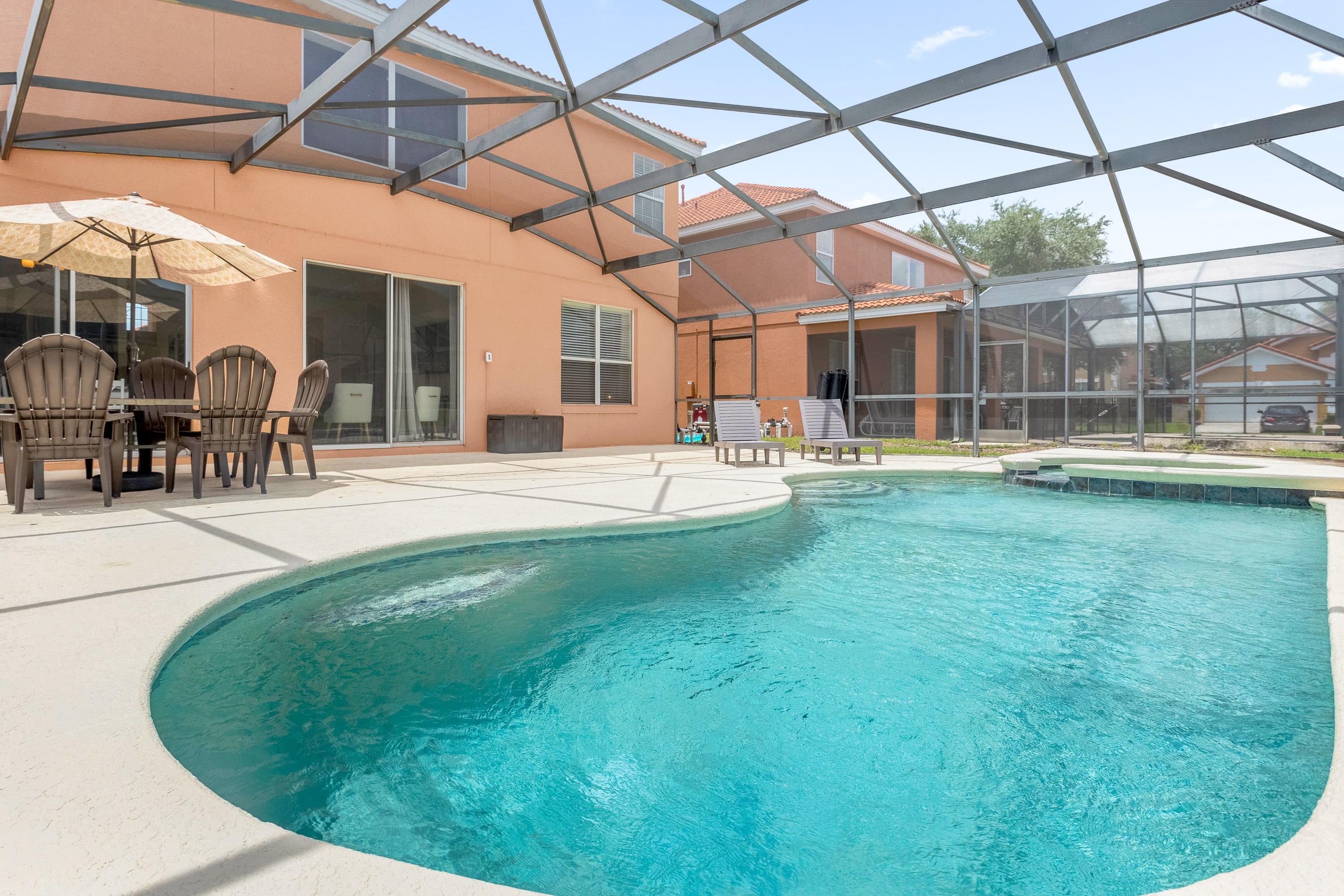 Large back sundeck patio with private swimming pool and hot tub