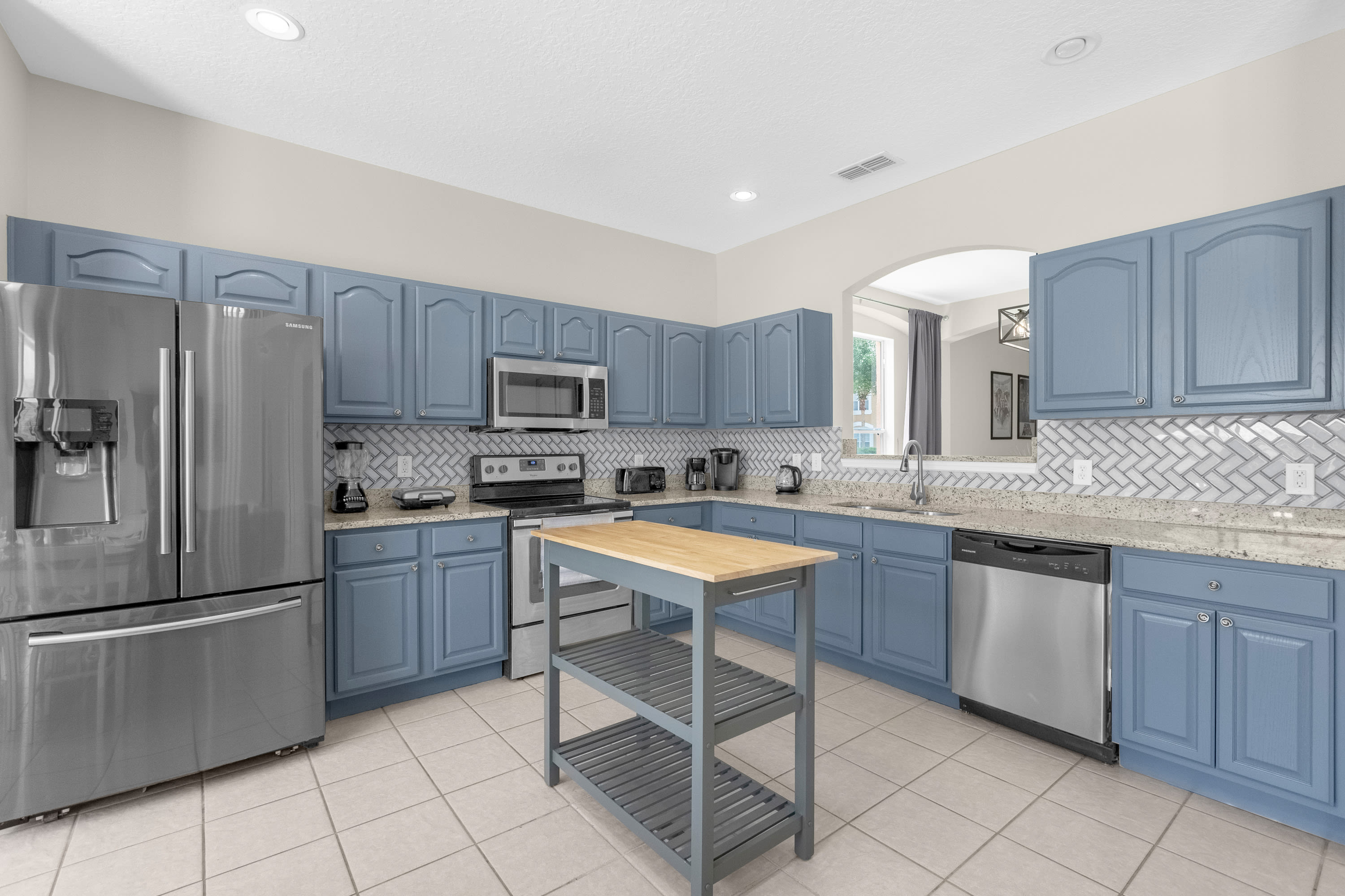 Fully Equipped Chef's Kitchen With Stunning Blue Cabinetry