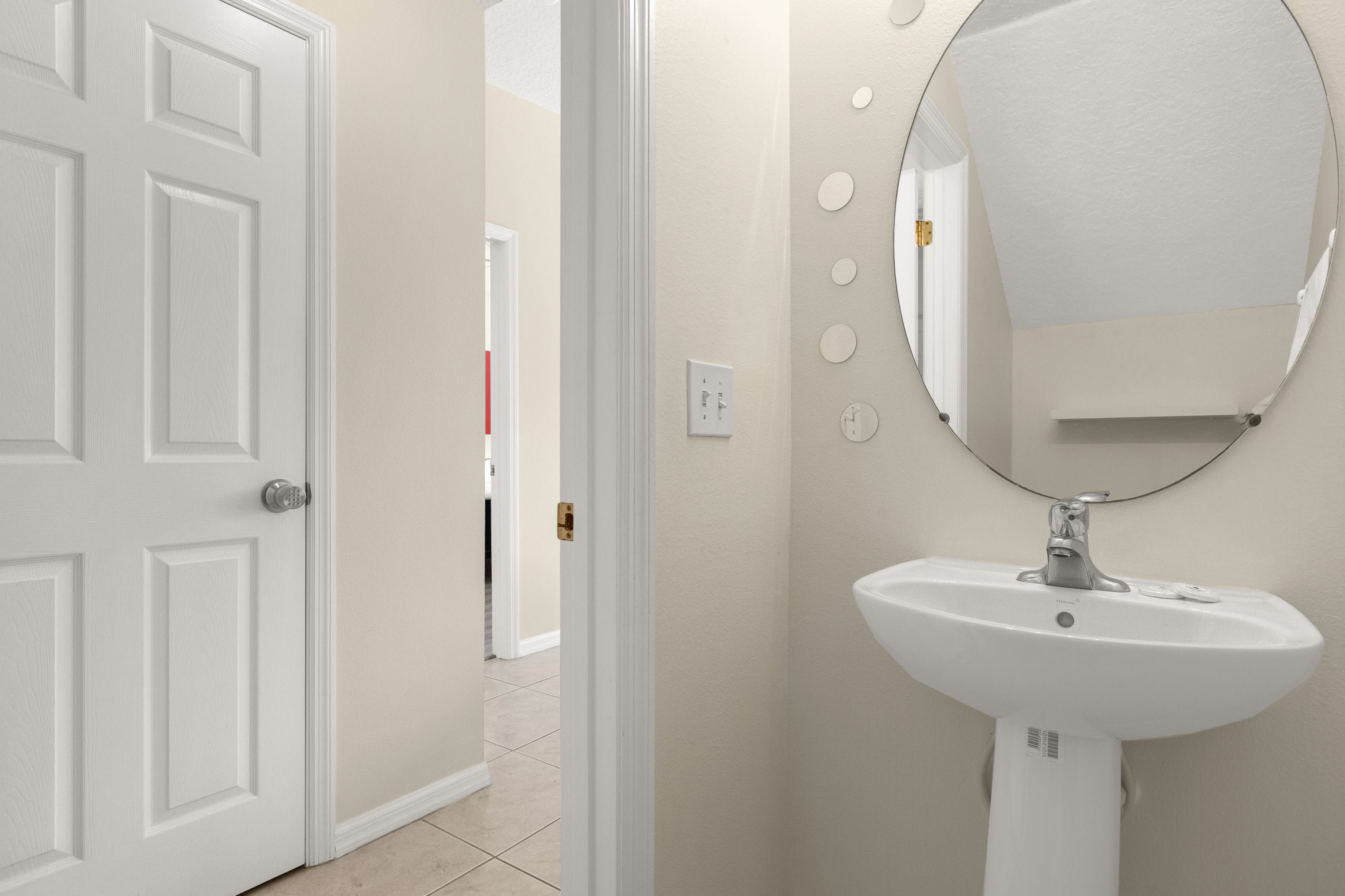 Spacious Bathroom Featuring Elegant Fixtures And Ample Lighting