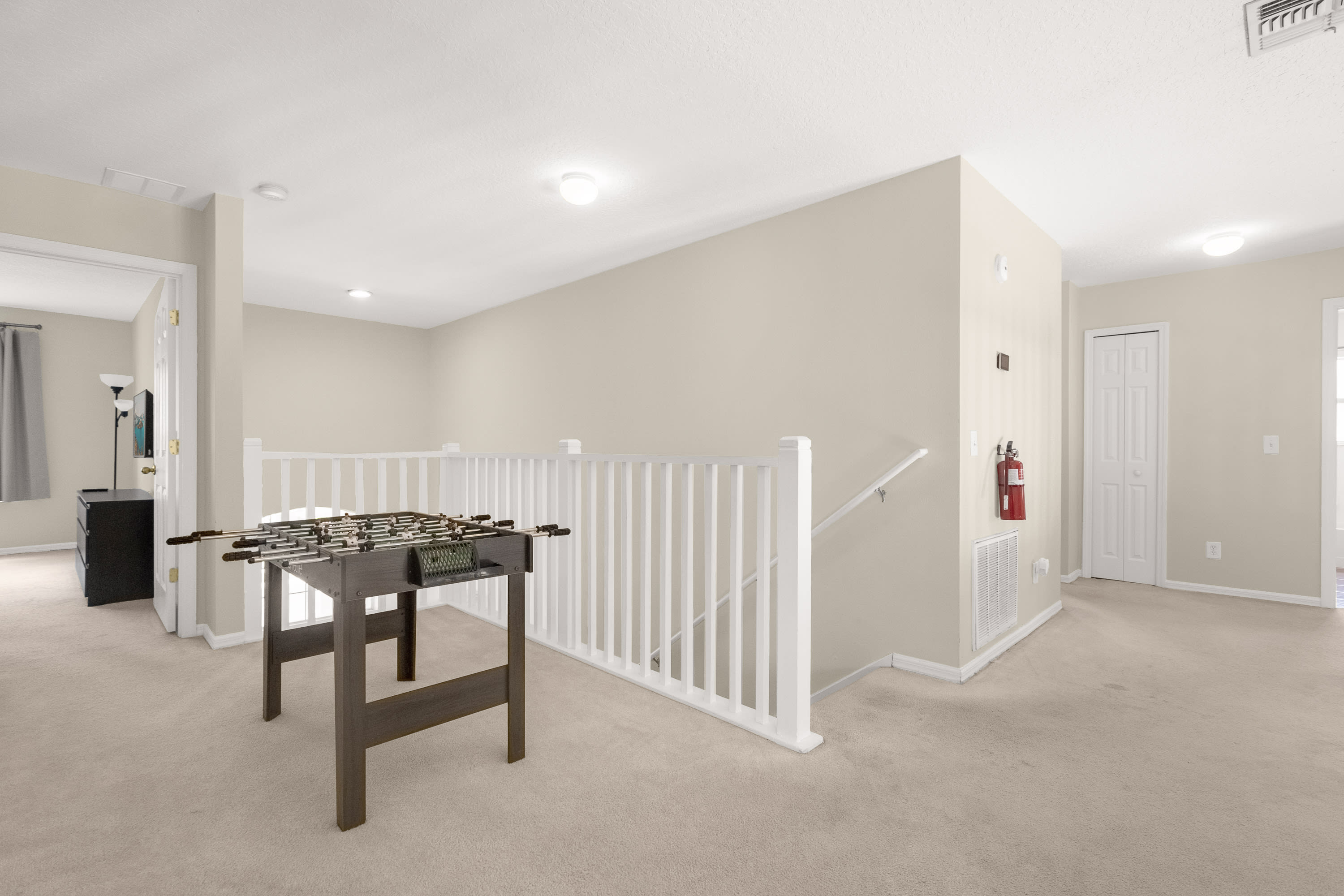 Spacious Hallway Leading To Recreational Spaces And Living Areas