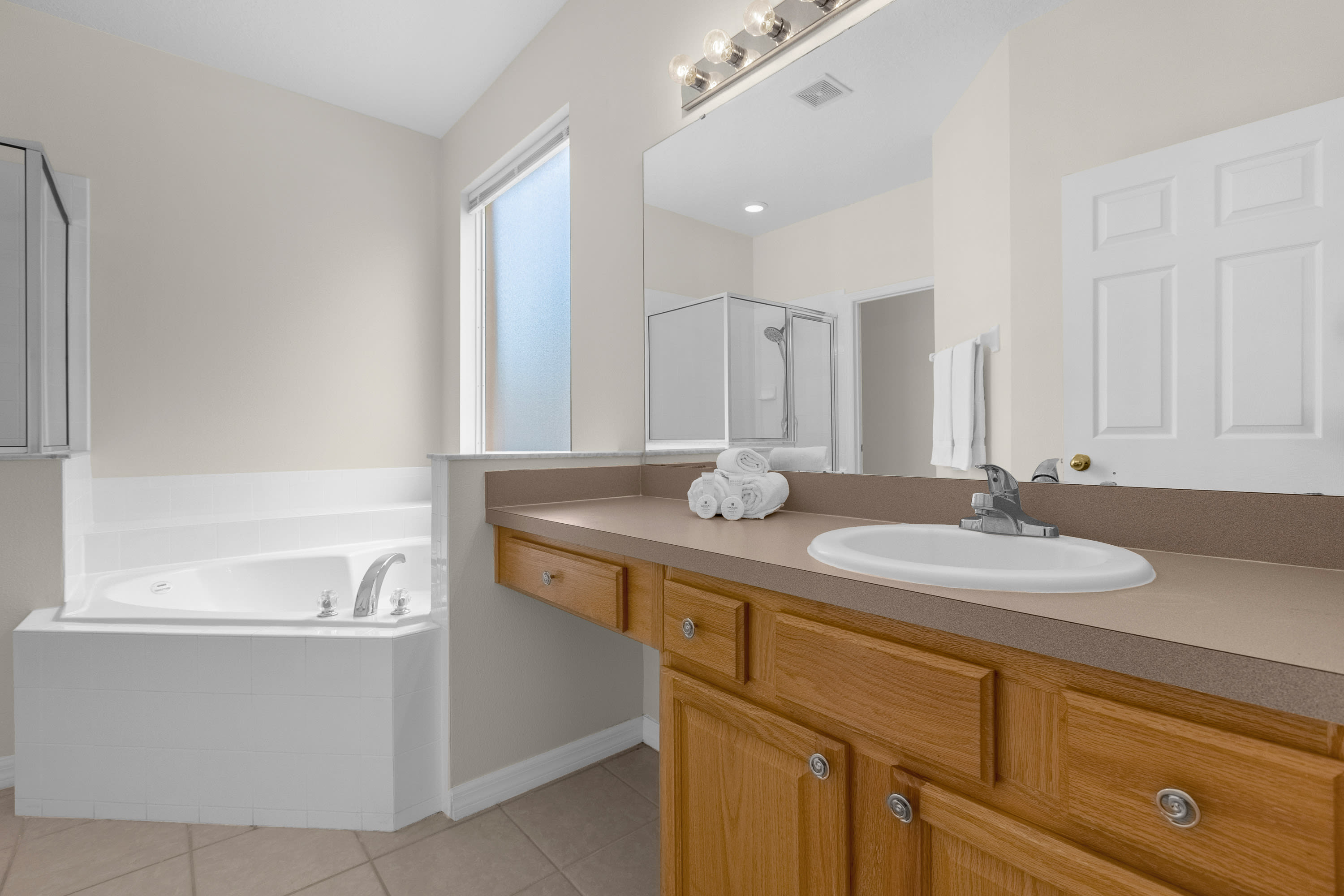 Luxurious Bathroom With Double Vanity And Spa Tub