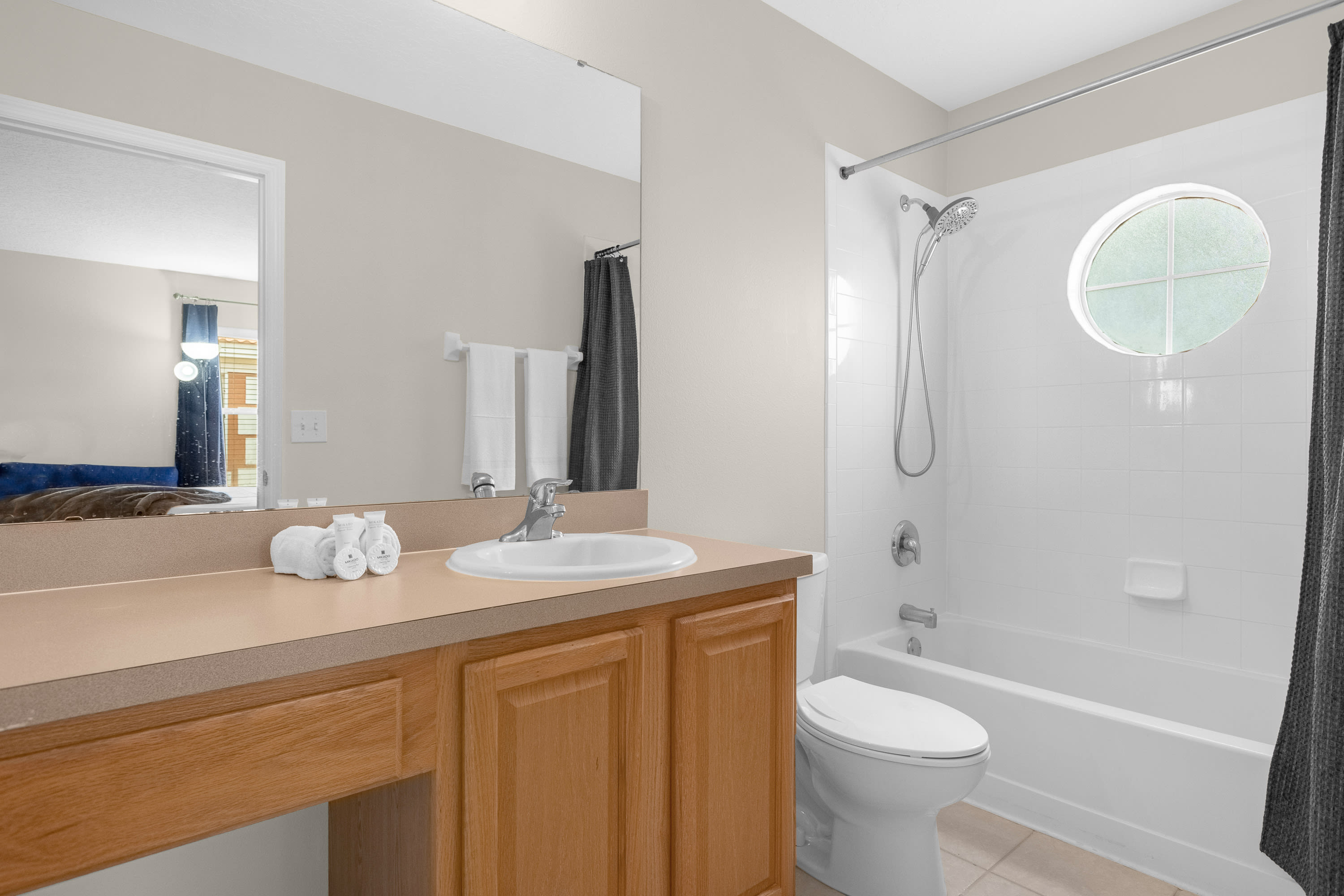 Spacious Bathroom Featuring Contemporary Design And Warm Accents