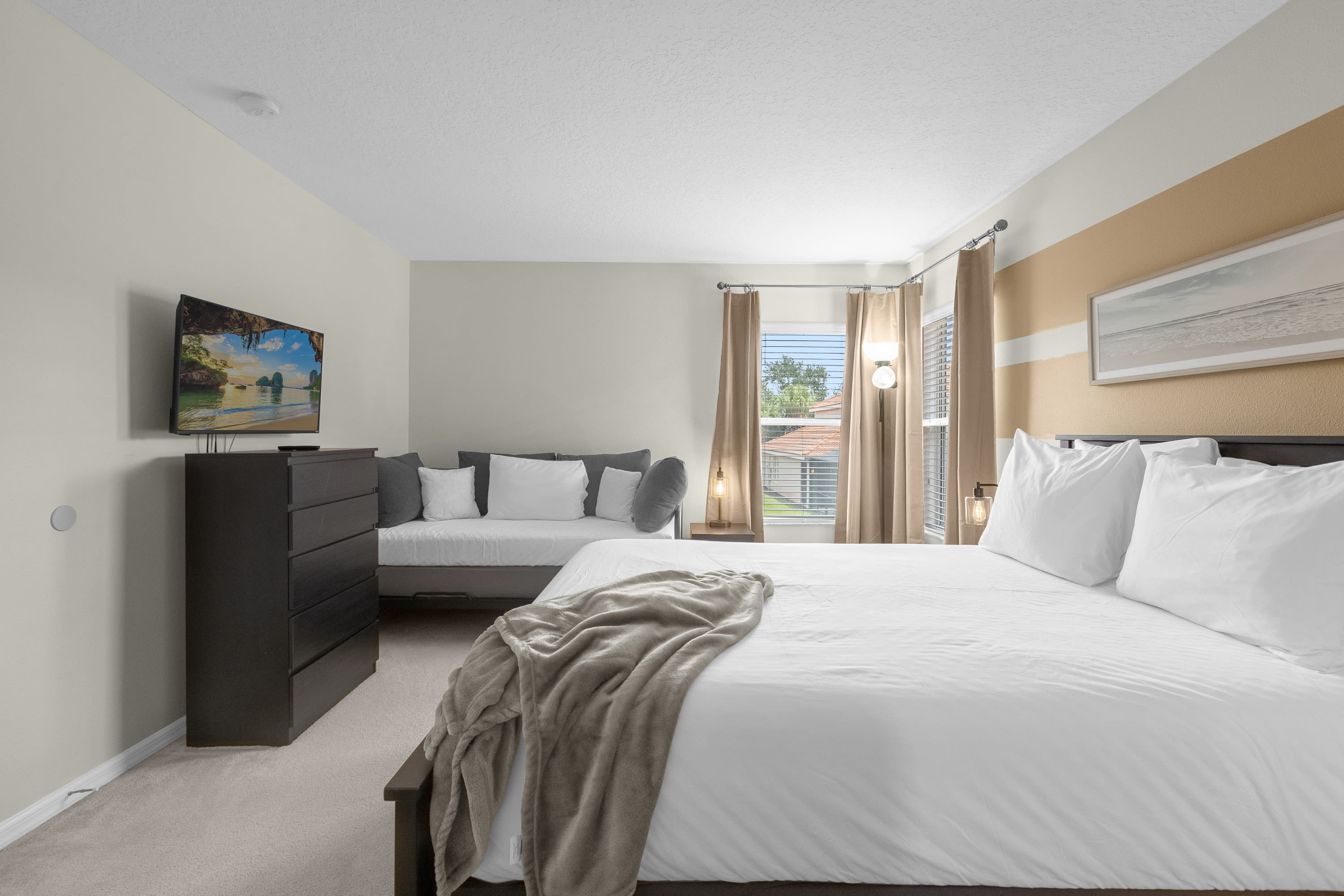 Queen Bedroom With Private Sitting Area And Smart TV