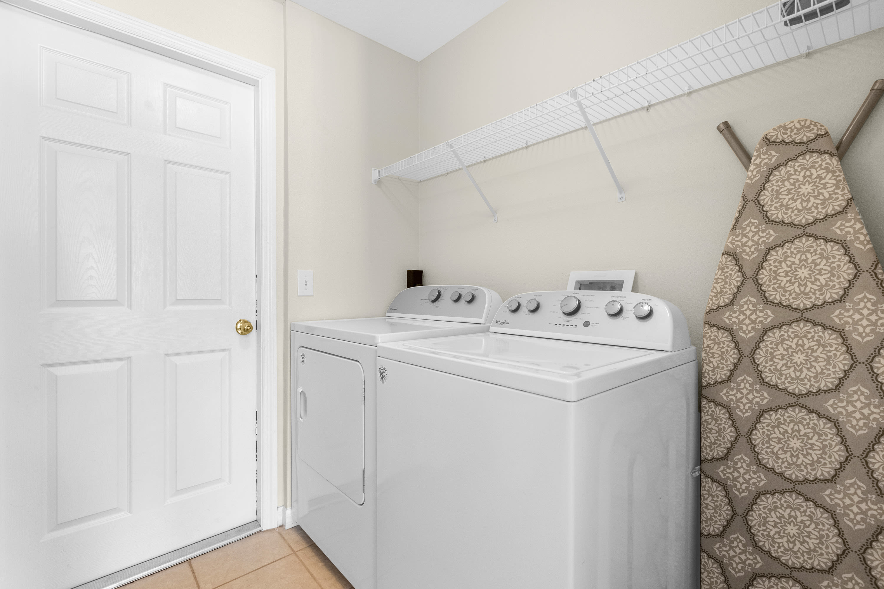 Convenient Laundry Area With Washer And Dryer For Guest Use