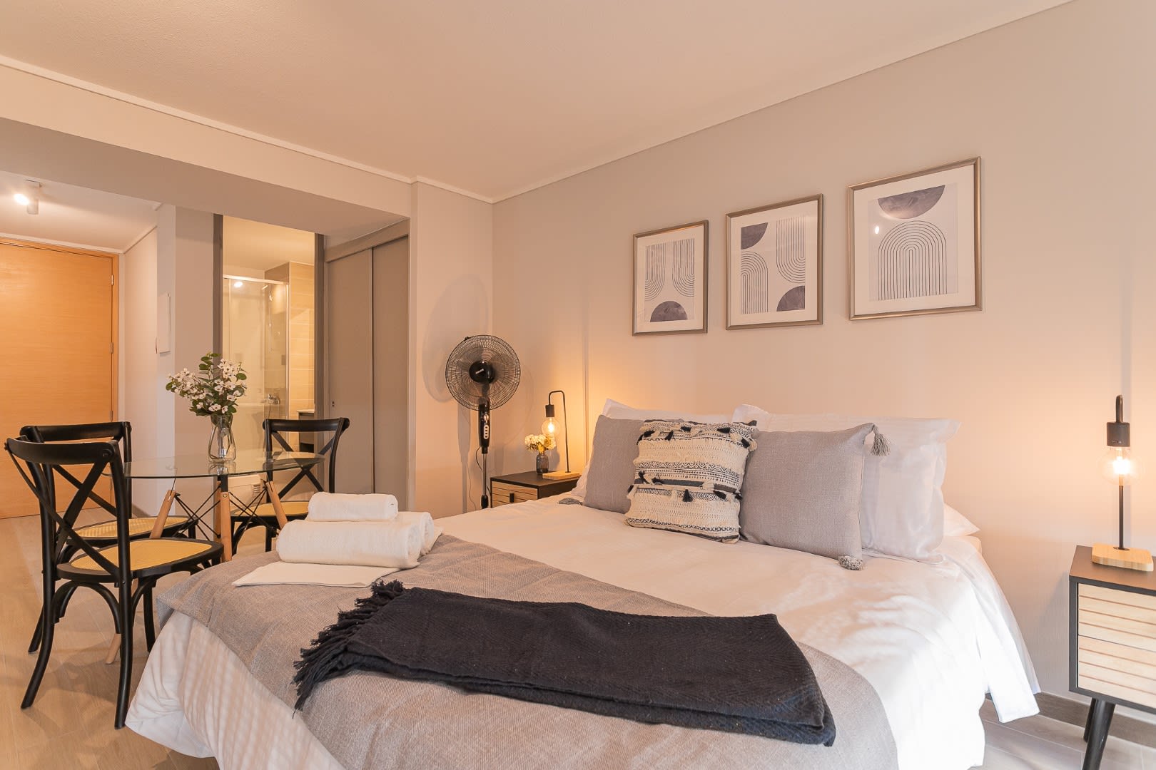 Relax in this stylish studio featuring modern decor and cozy bedding, perfect for a tranquil stay in the heart of Chile.