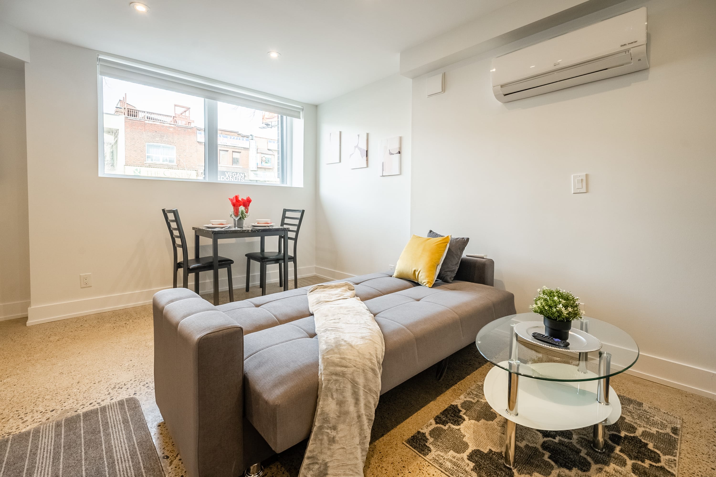 Living room with sofa bed and air conditioning
