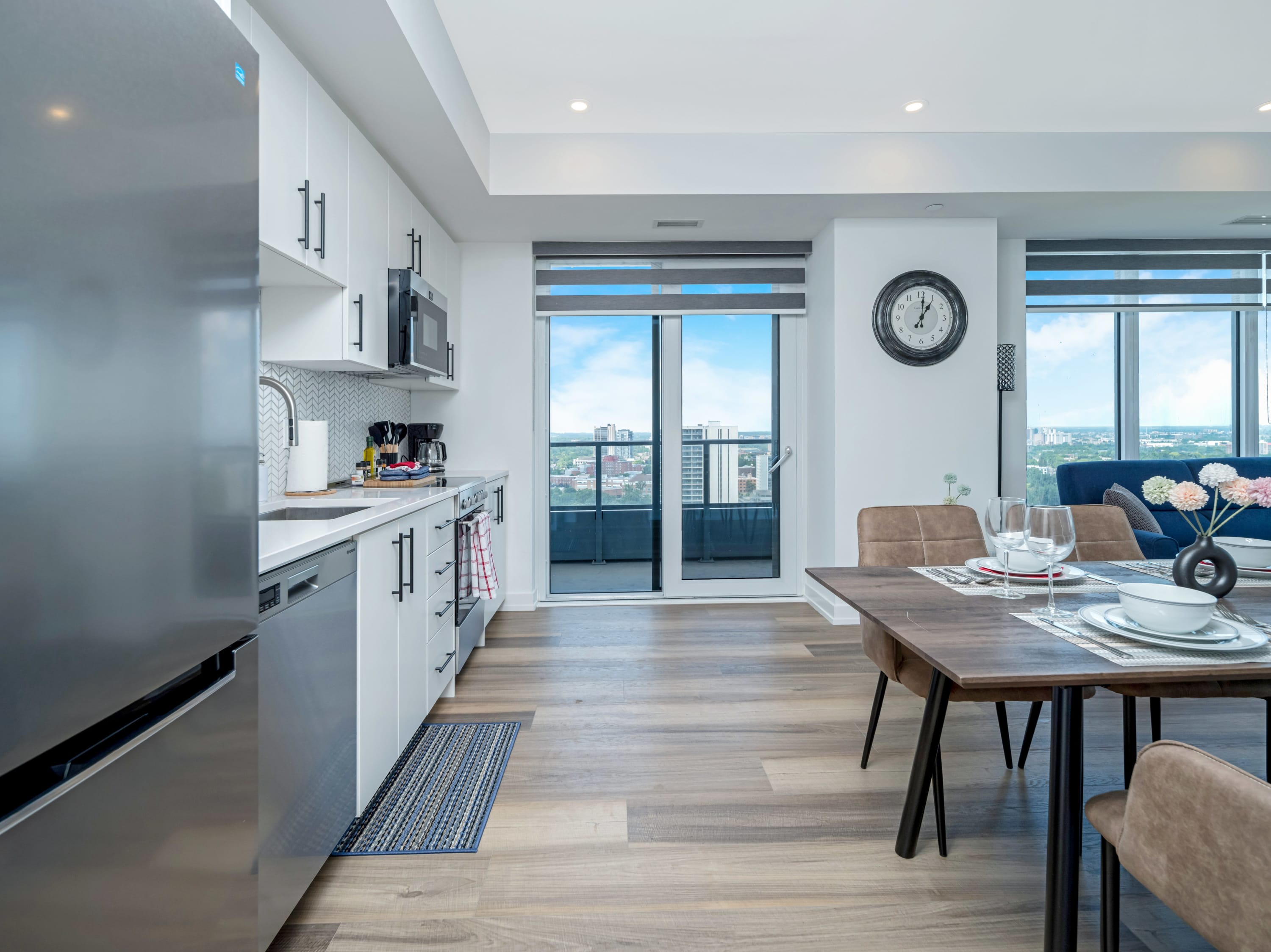 Fully Equipped Kitchen With Quartz Countertops And Stainless Steel Appliances