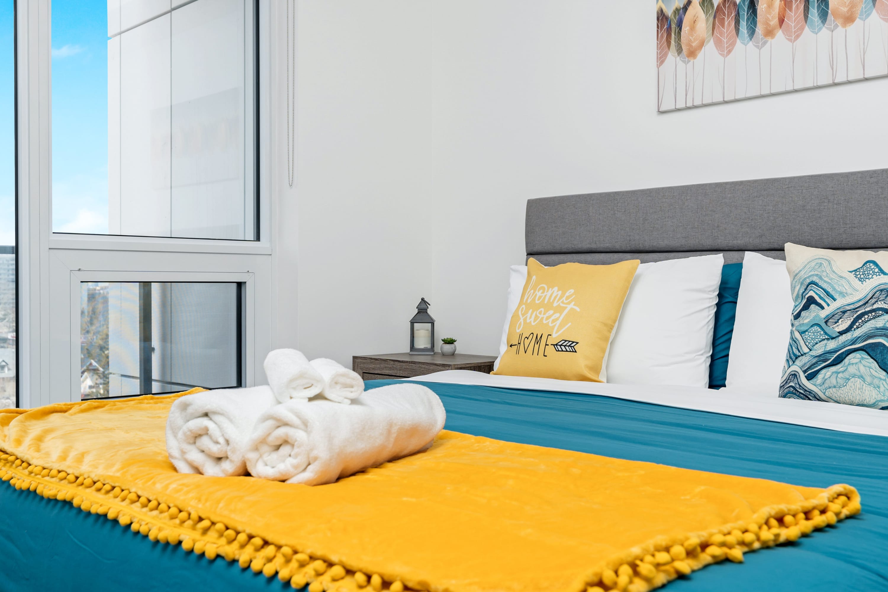 Bright Bedroom With Large Windows Offering Stunning Views And Plenty Of Natural Light For A Relaxing Atmosphere