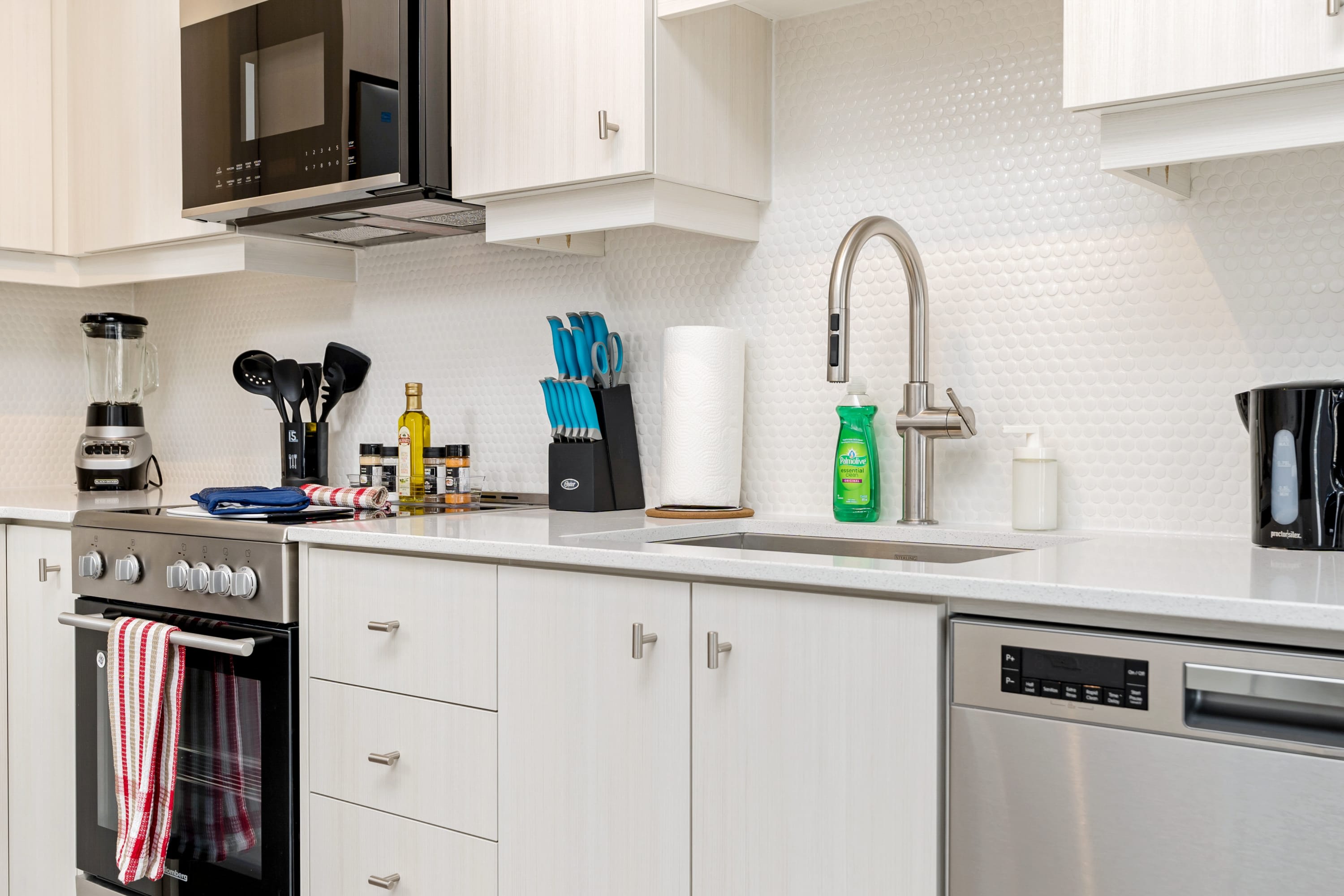 Modern Kitchen With Full-Size Fridge Dishwasher Microwave And Oven Perfect For Preparing Delicious Meals