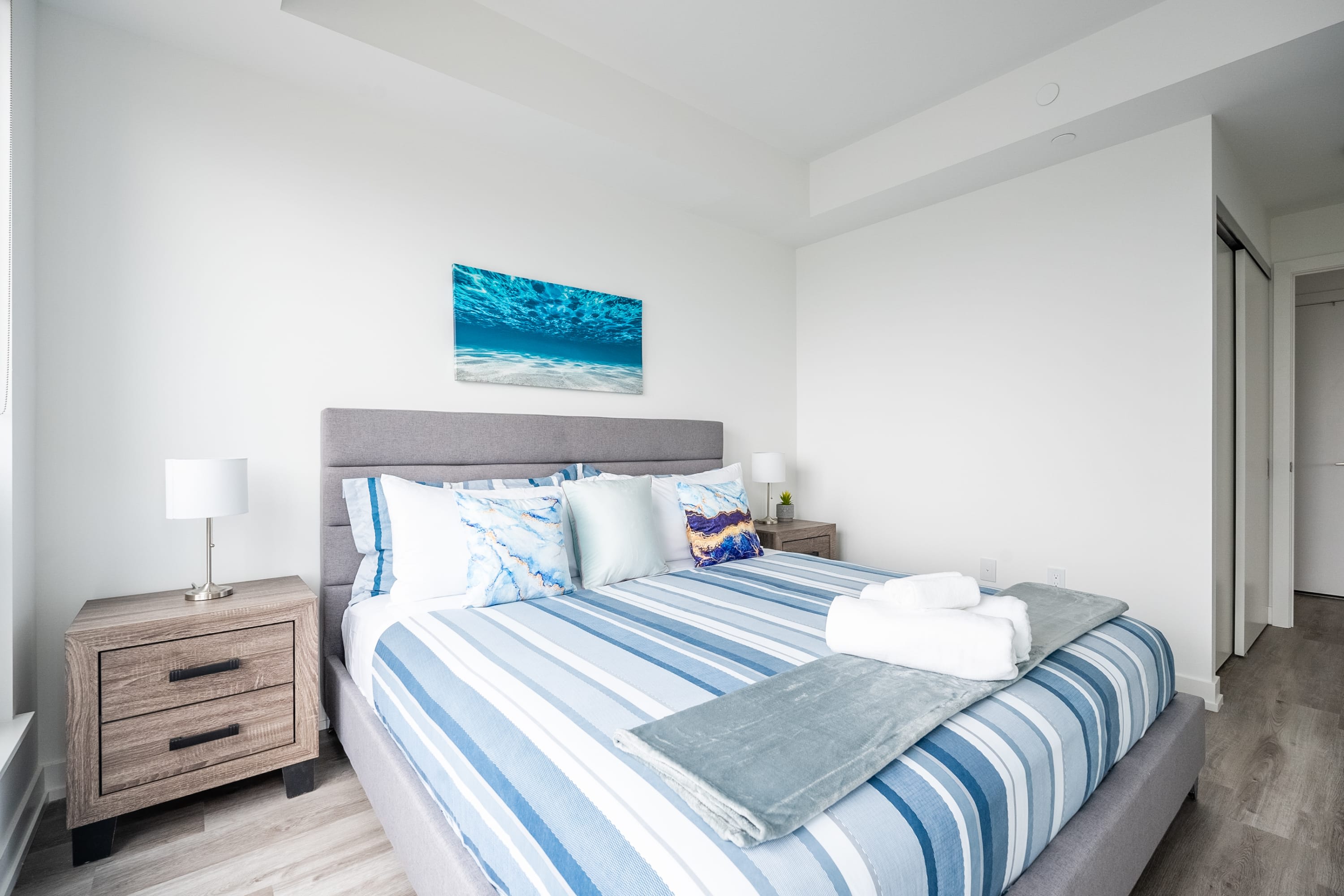 Comfortable Bedroom With Stylish Decor And Plenty Of Natural Light