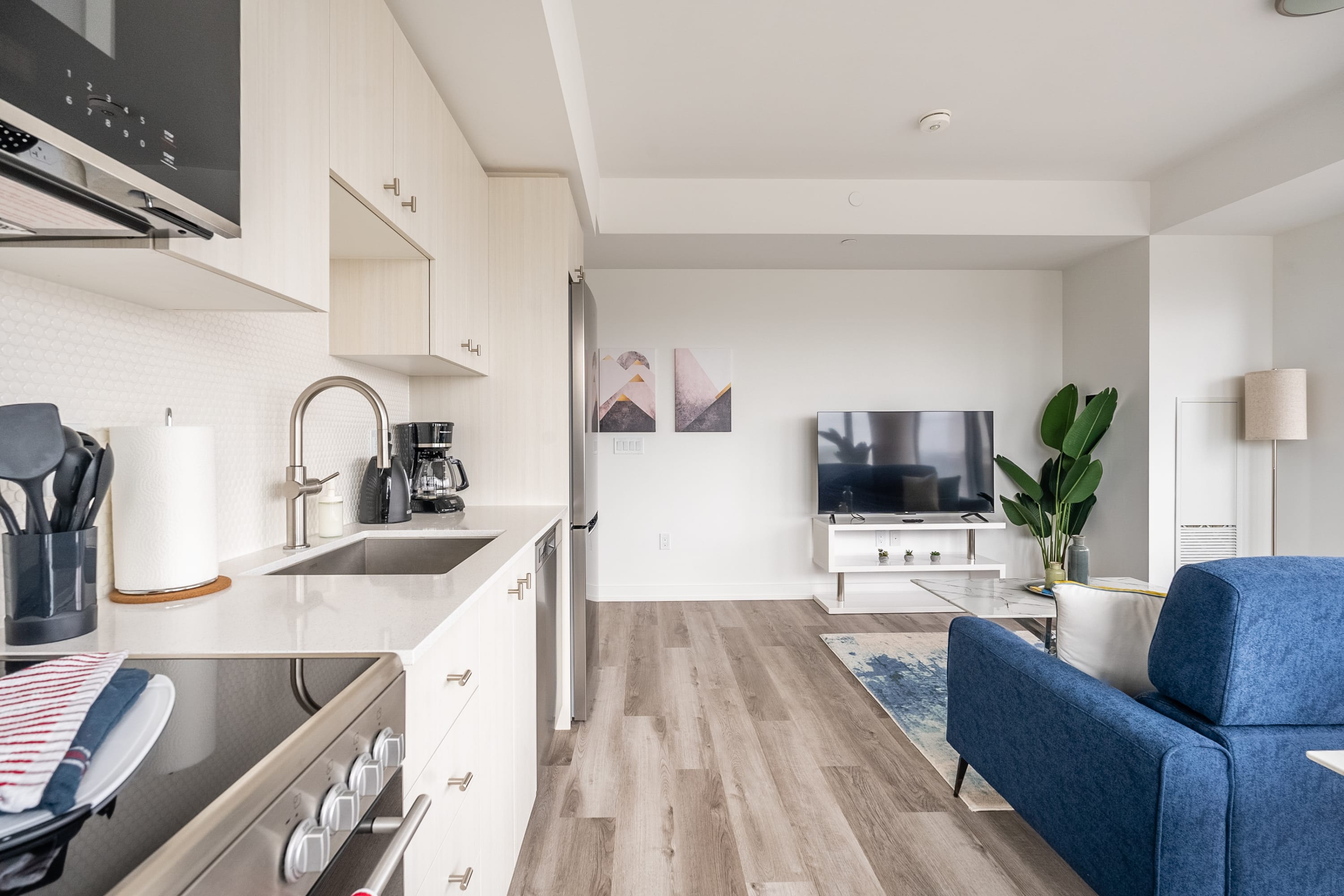 Fully Equipped Kitchen With Stainless Steel Appliances And Ample Counter Space