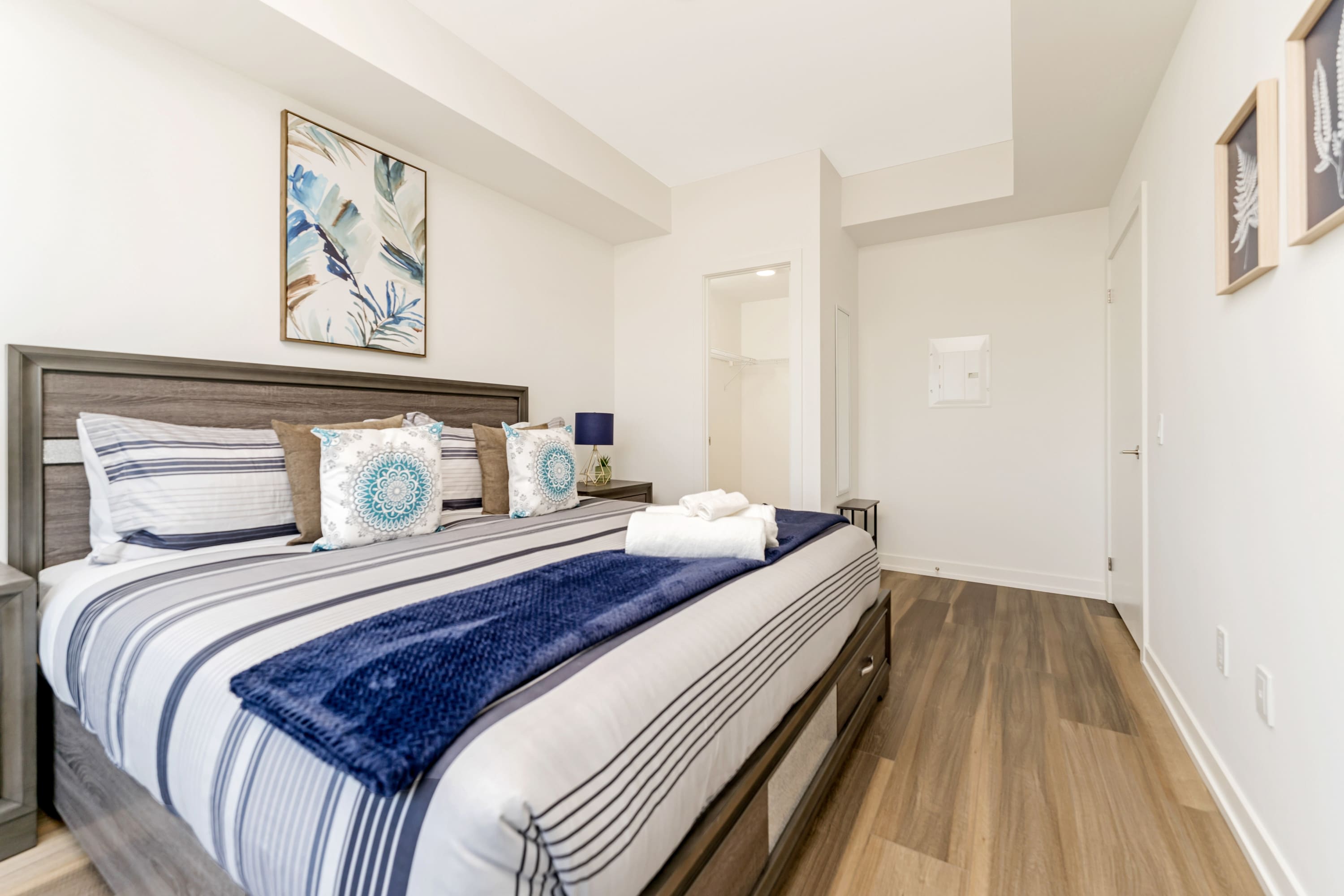 Bright Bedroom With A King Size Bed And Large Windows Offering Scenic Views