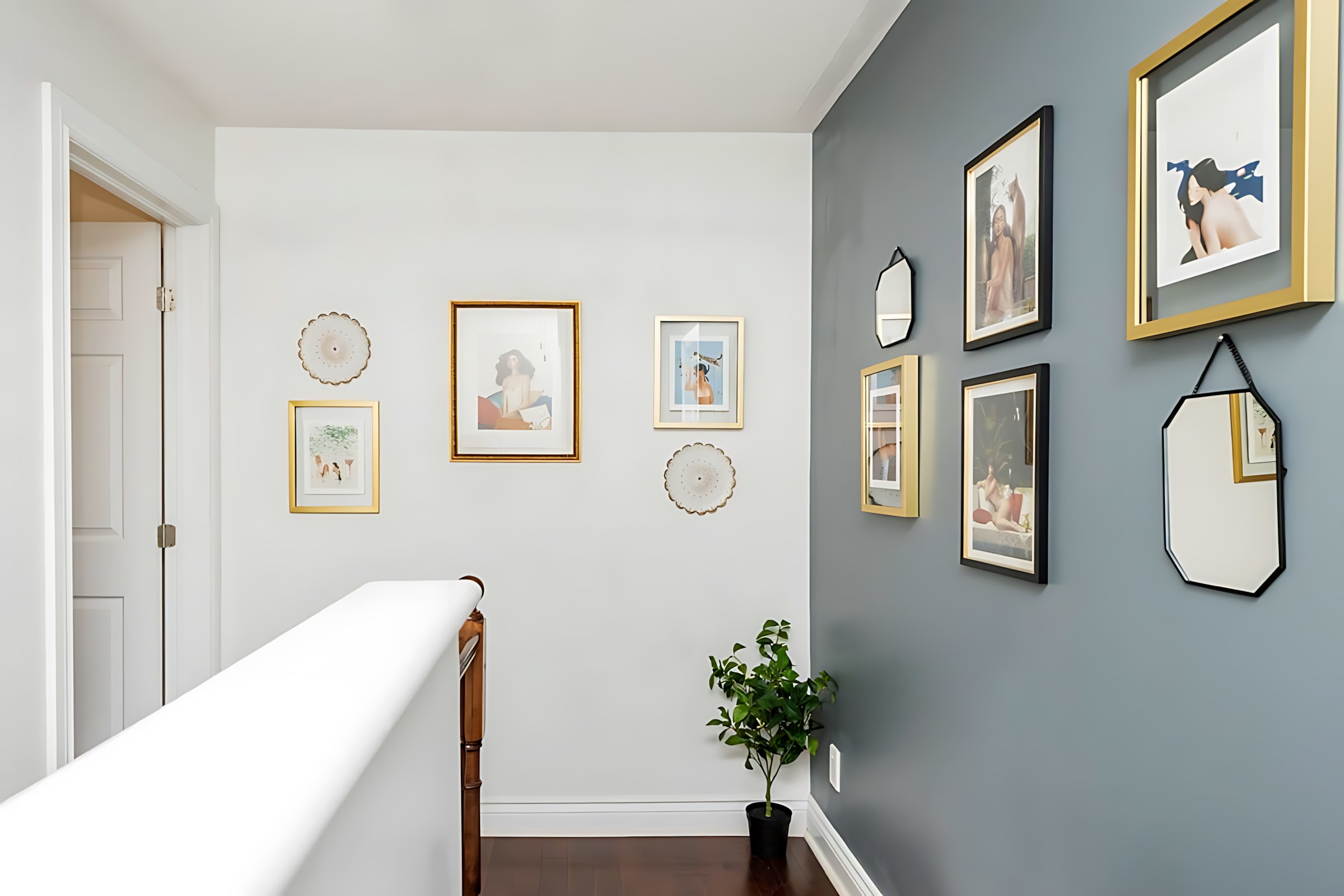 Stylish Hallway Accented With Art And Mirrors