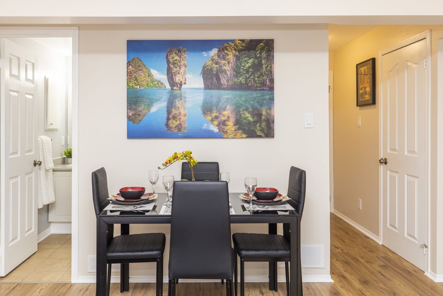 The dining table comfortably seats four.