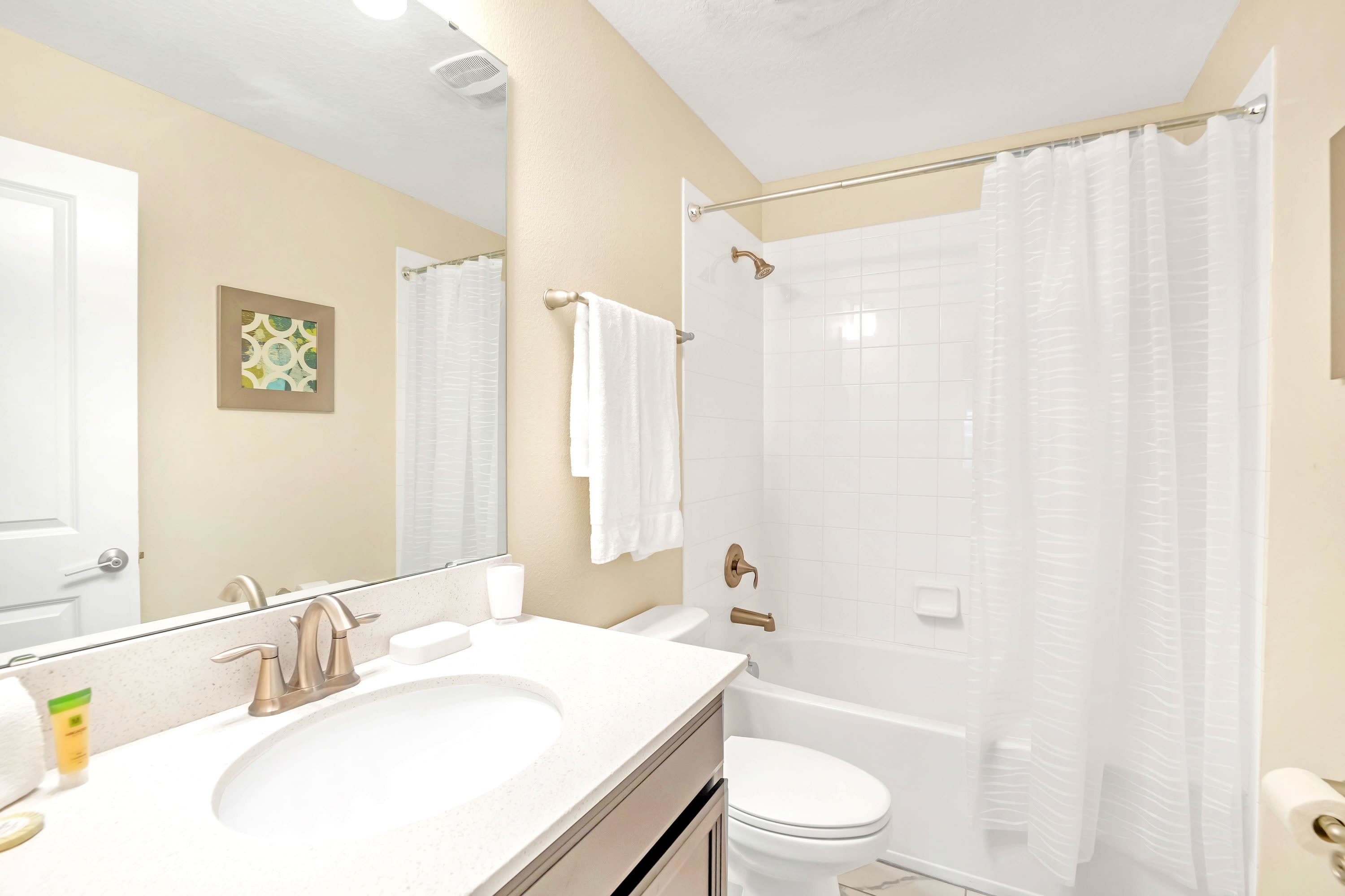 Spacious Bathroom With Elegant Touches And A Walking Shower