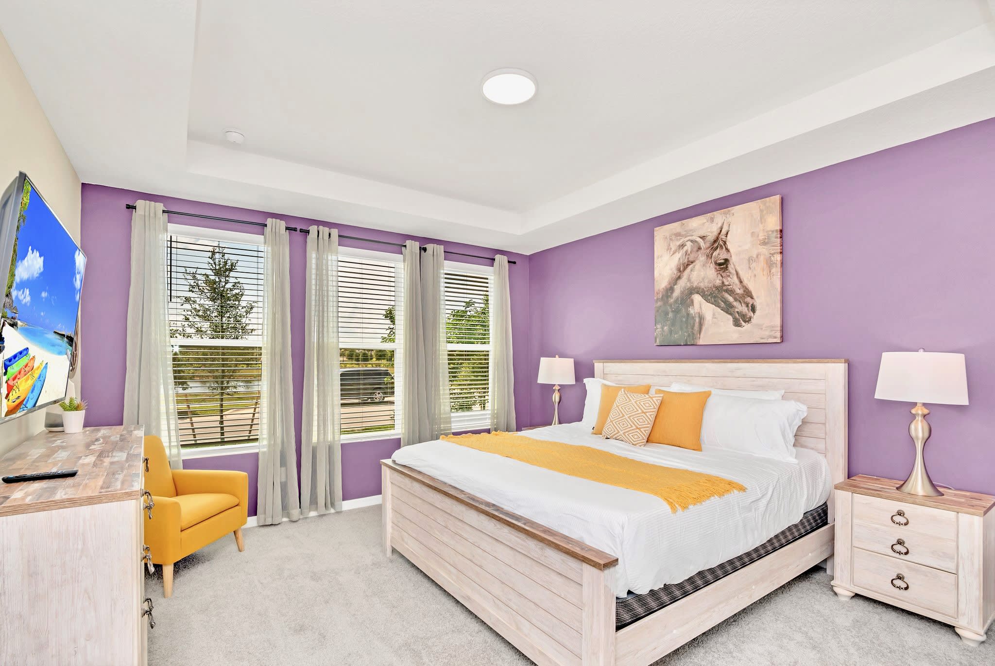 Elegant King Bedroom Featuring Soft Pastel Colors And Ample Natural Light