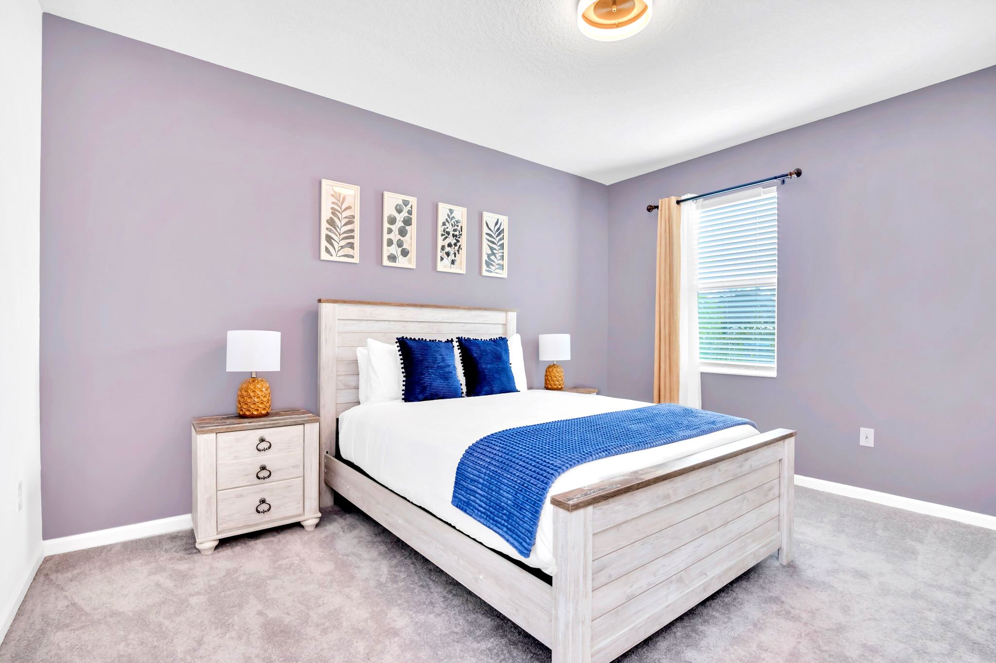 Queen Bedroom With Decorative Wall Art And Comfortable Bedding