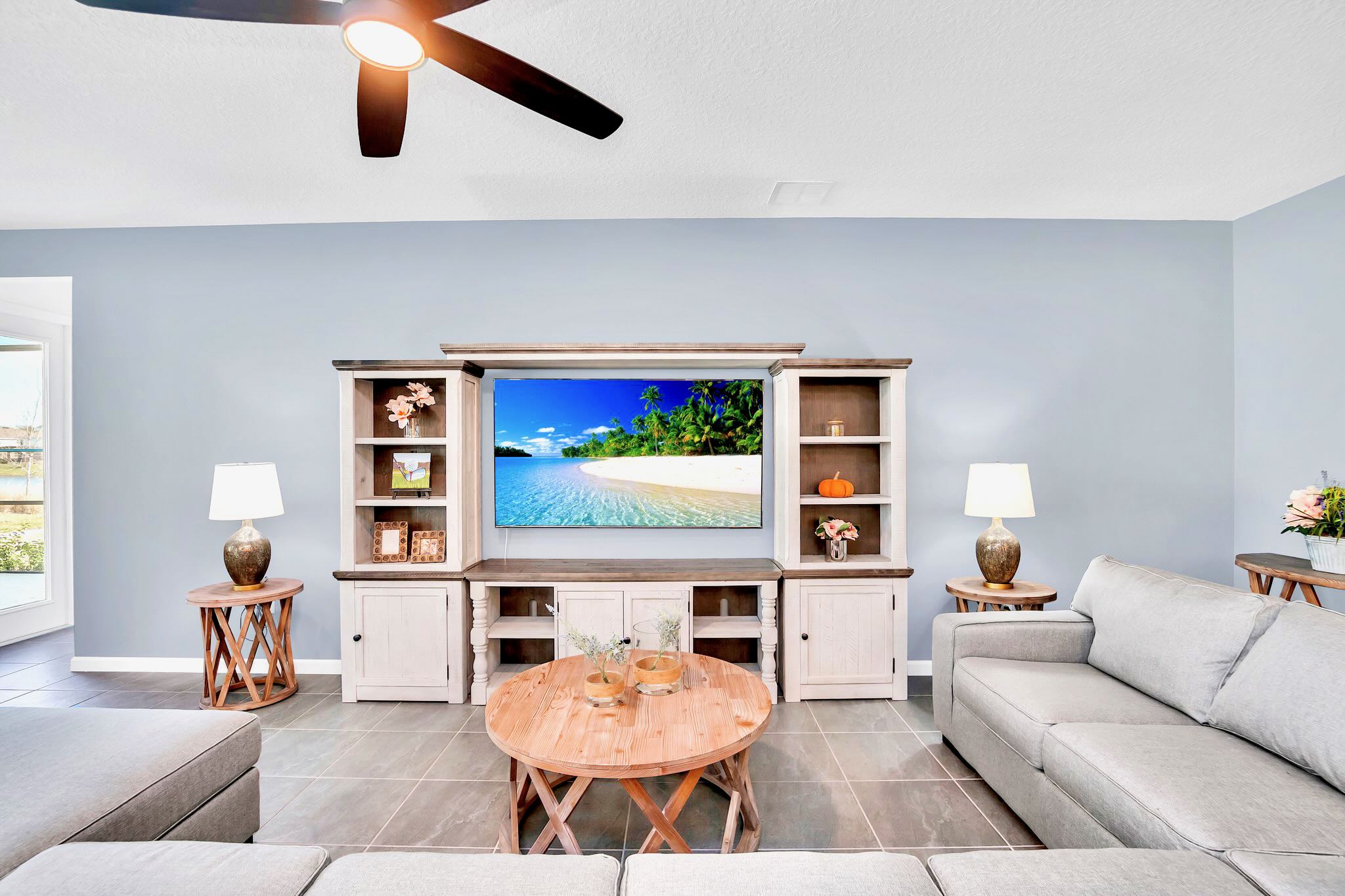 Comfortable Entertainment Space With Large TV And Elegant Design