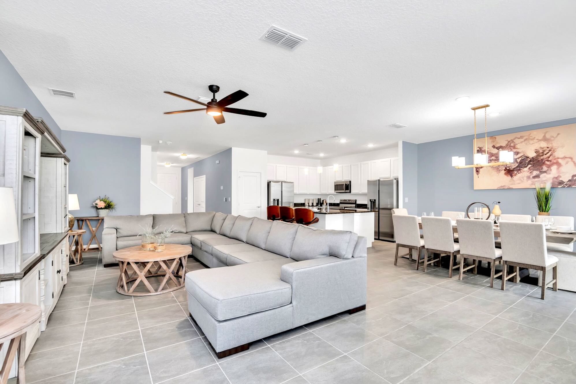 Bright And Open Living Area With Plush Sectional And 65