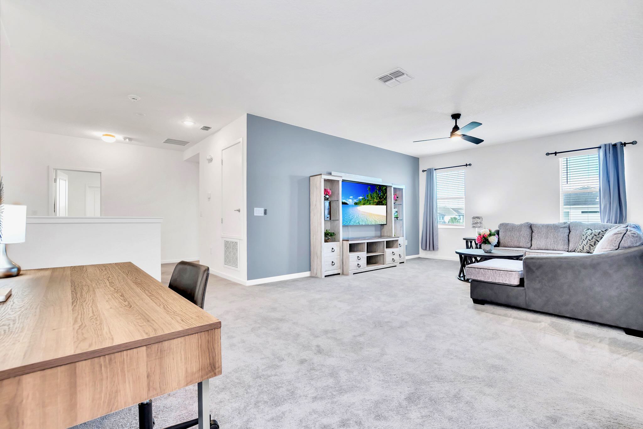 Spacious Living Room With Modern Furnishings And Natural Light