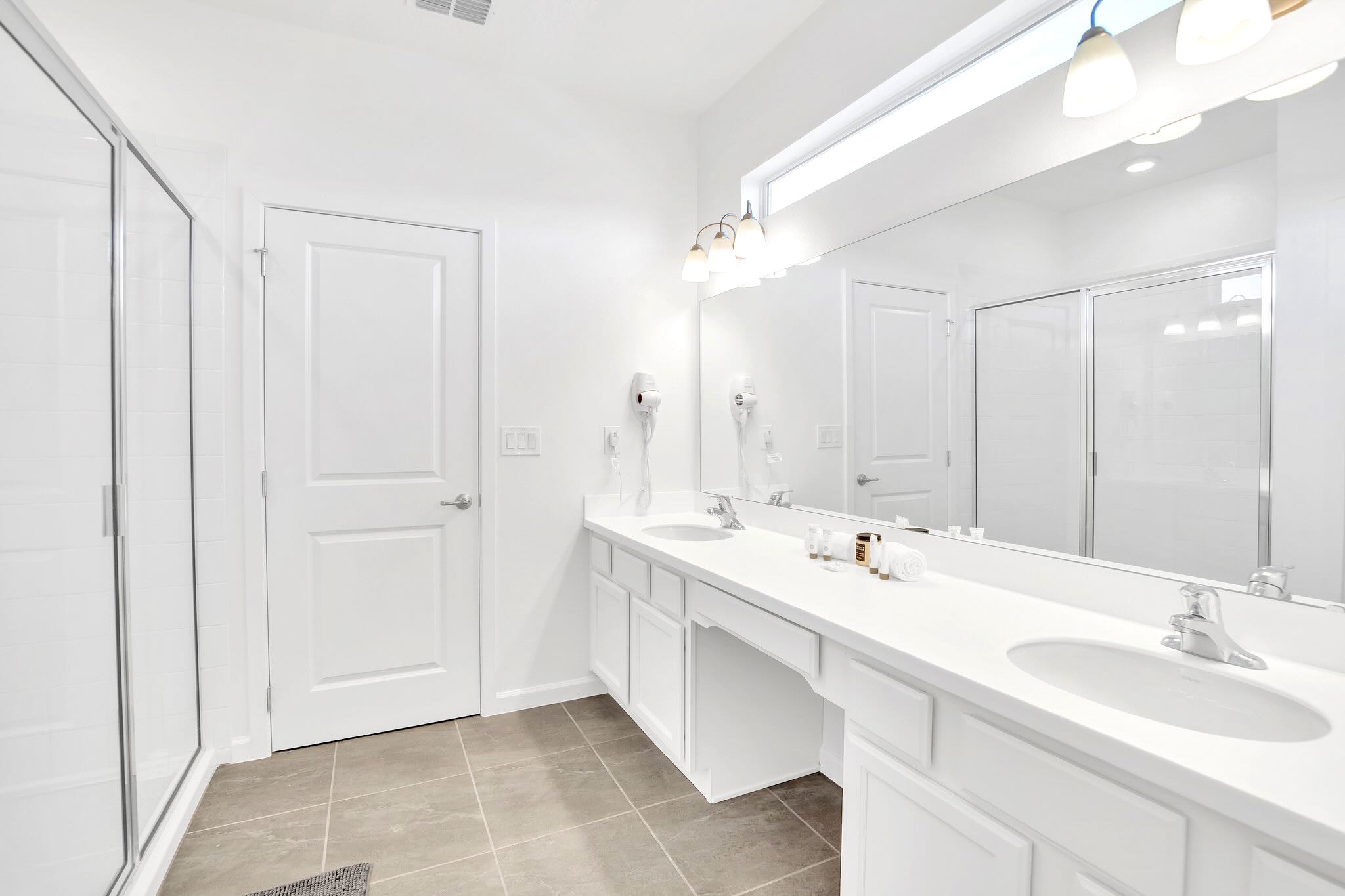 Bright Bathroom With Dual Sinks And Ample Counter Space
