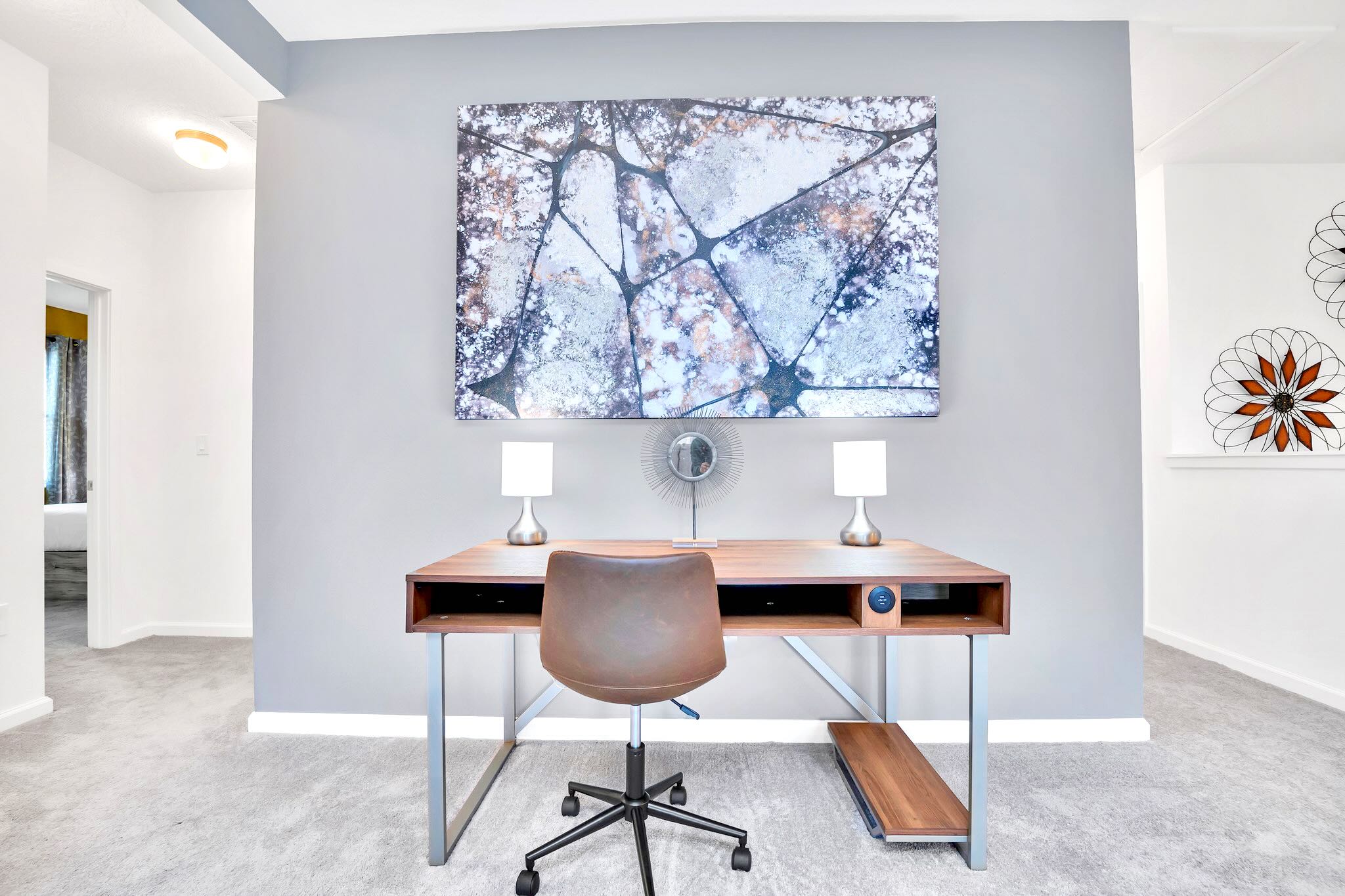 Dedicated Workspace With Desk, Chair, And Stylish Artwork