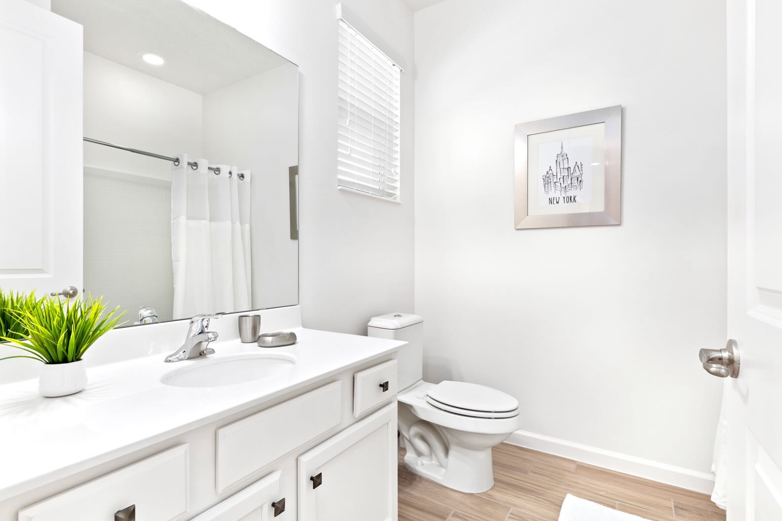 Bright Bathroom With Modern Fixtures And Shower Tub Combo