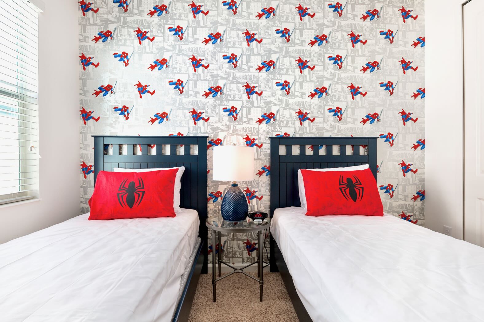 Spider-Man Themed Twin Bedroom With Bold Colors And Whimsical Wallpaper