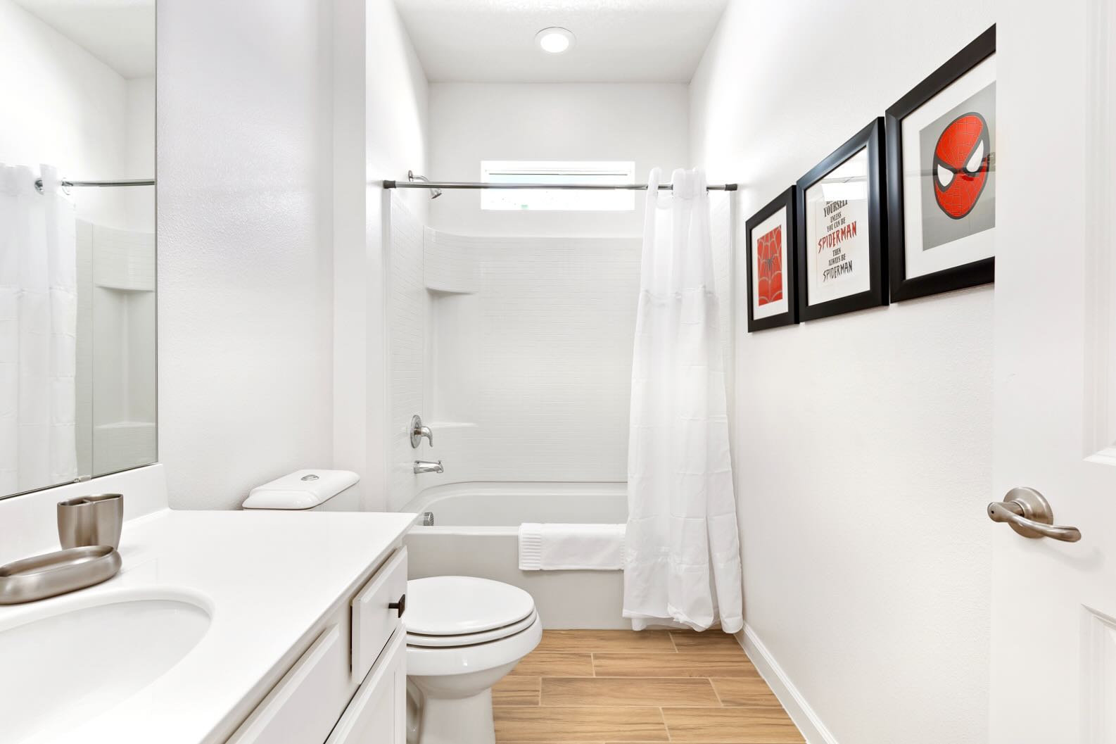 Bright Bathroom Featuring Clean Lines And A Shower Tub Combo