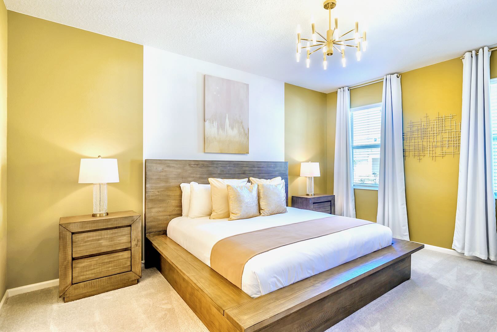 Elegant Bedroom With A King Bed, Warm Yellow Accents, And Natural Light