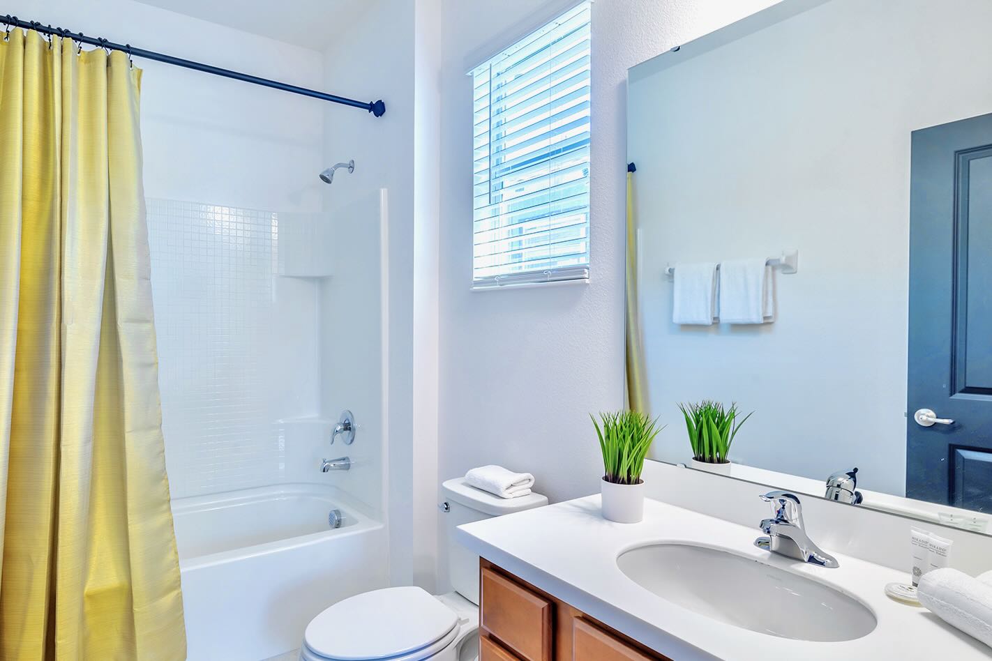 Bright And Spacious Bathroom Featuring A Double Vanity And Elegant Décor