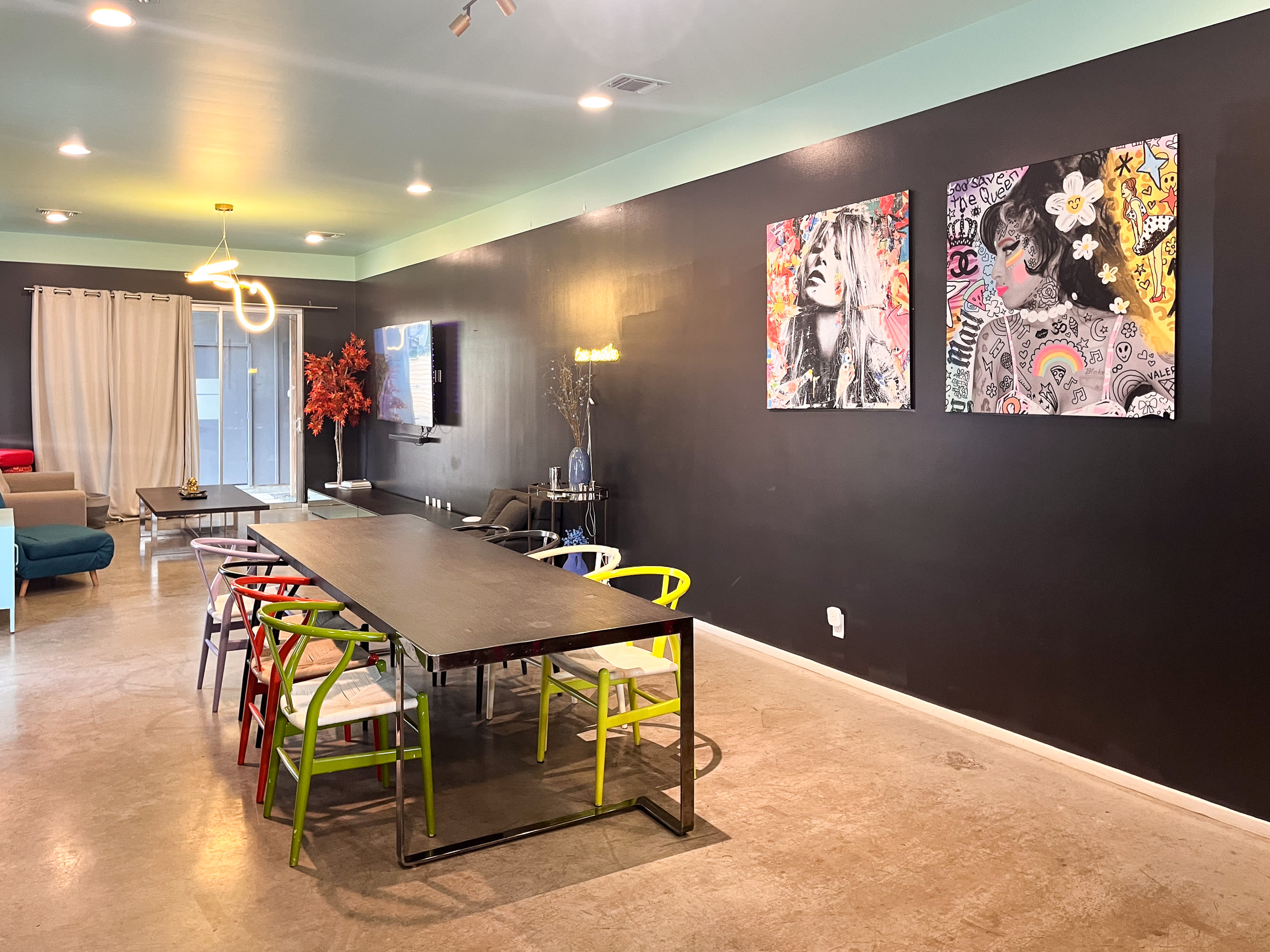 Open Concept Dining Space With Colorful Chairs And Contemporary Decor