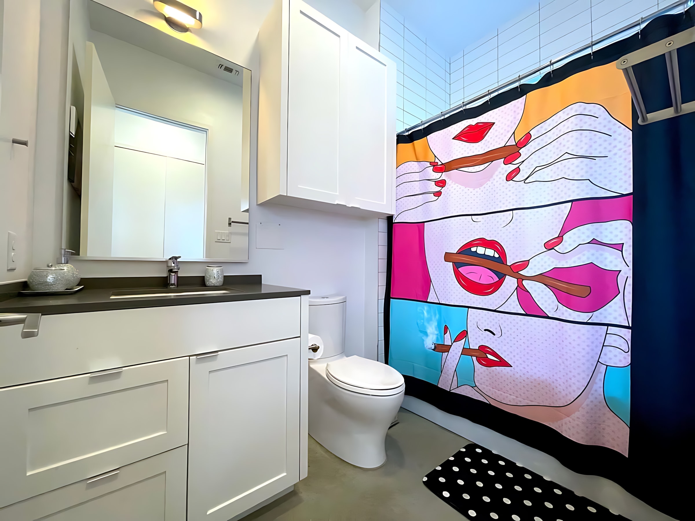 Bright Bathroom With Unique Art Accents And Functional Storage Space