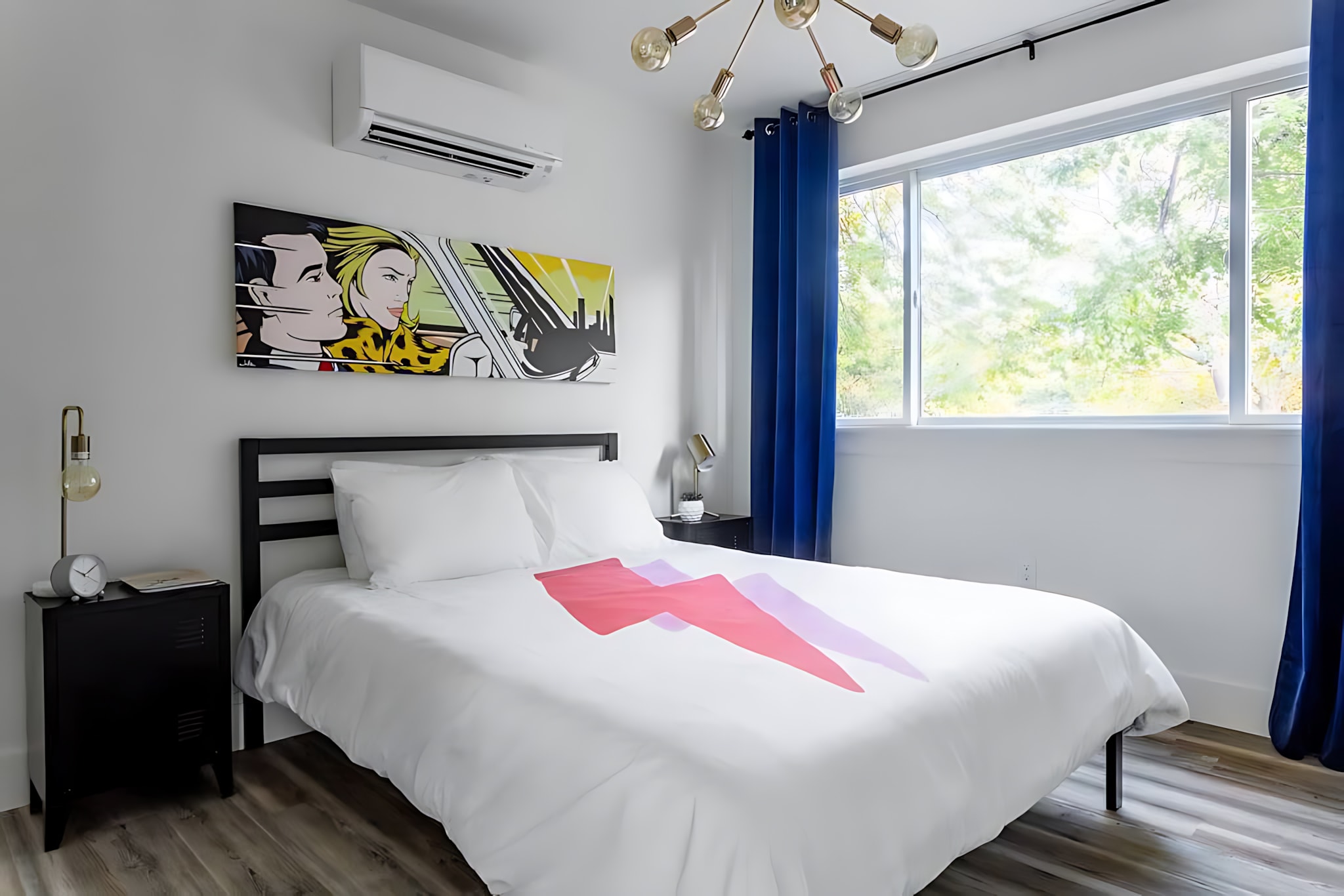 Cozy Bedroom With Queen Bed And Modern Pop Art Decor