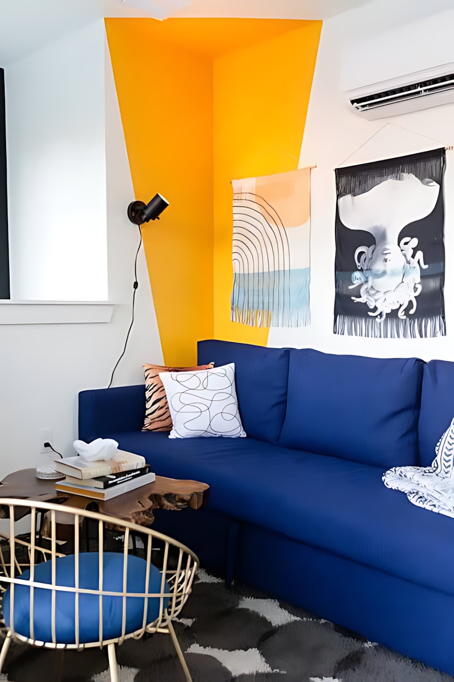 Bright Living Space Featuring A Comfortable Sofa Bed