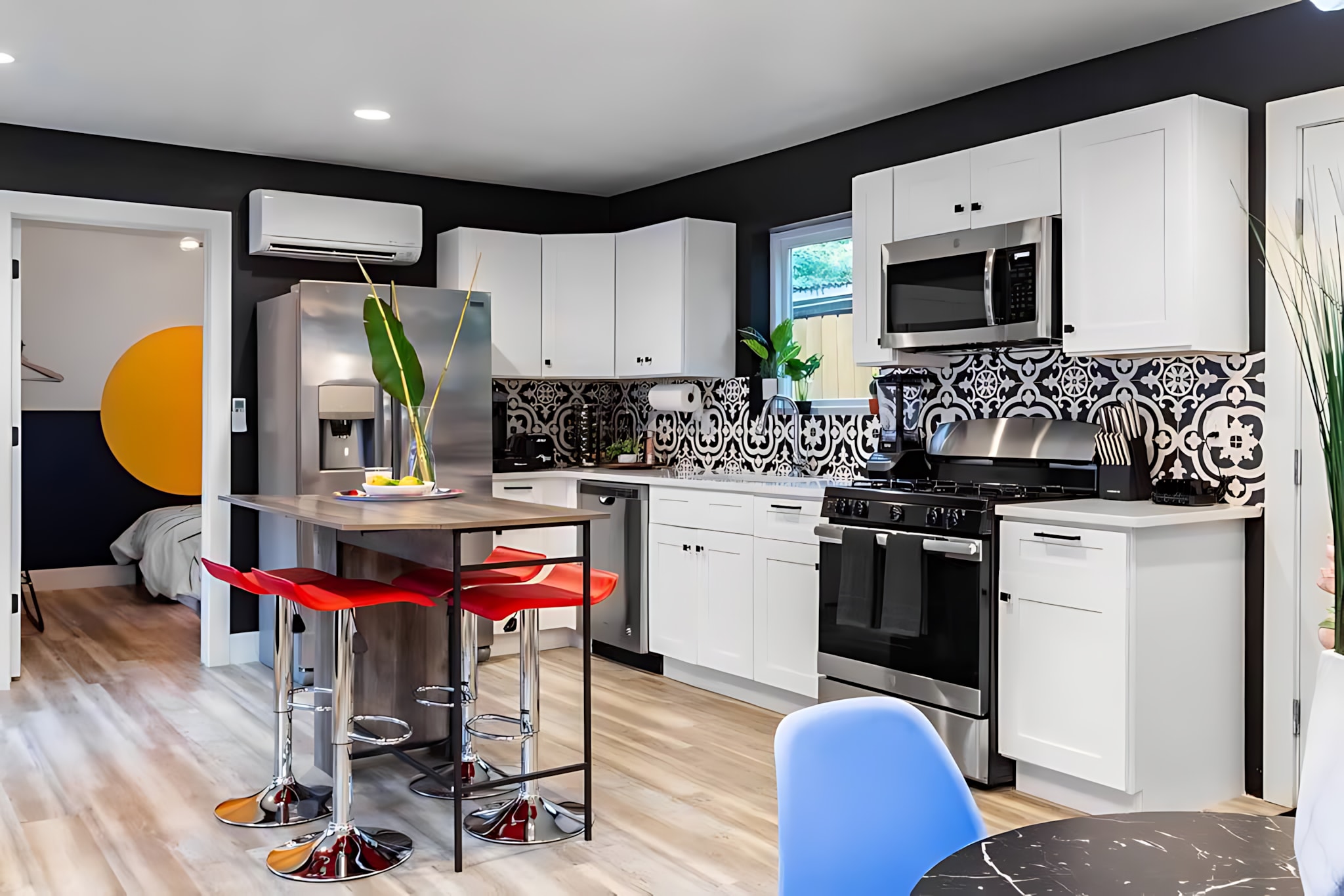 Fully Equipped Kitchen With Open Concept Design, Island, And Unique Lighting Features