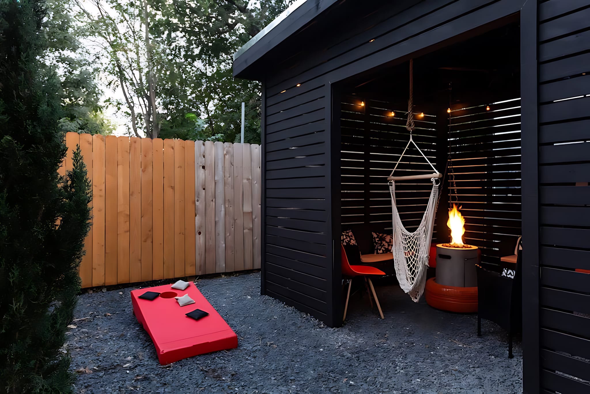 Spacious Outdoor Lounge With Fire Pit And Cornhole Game