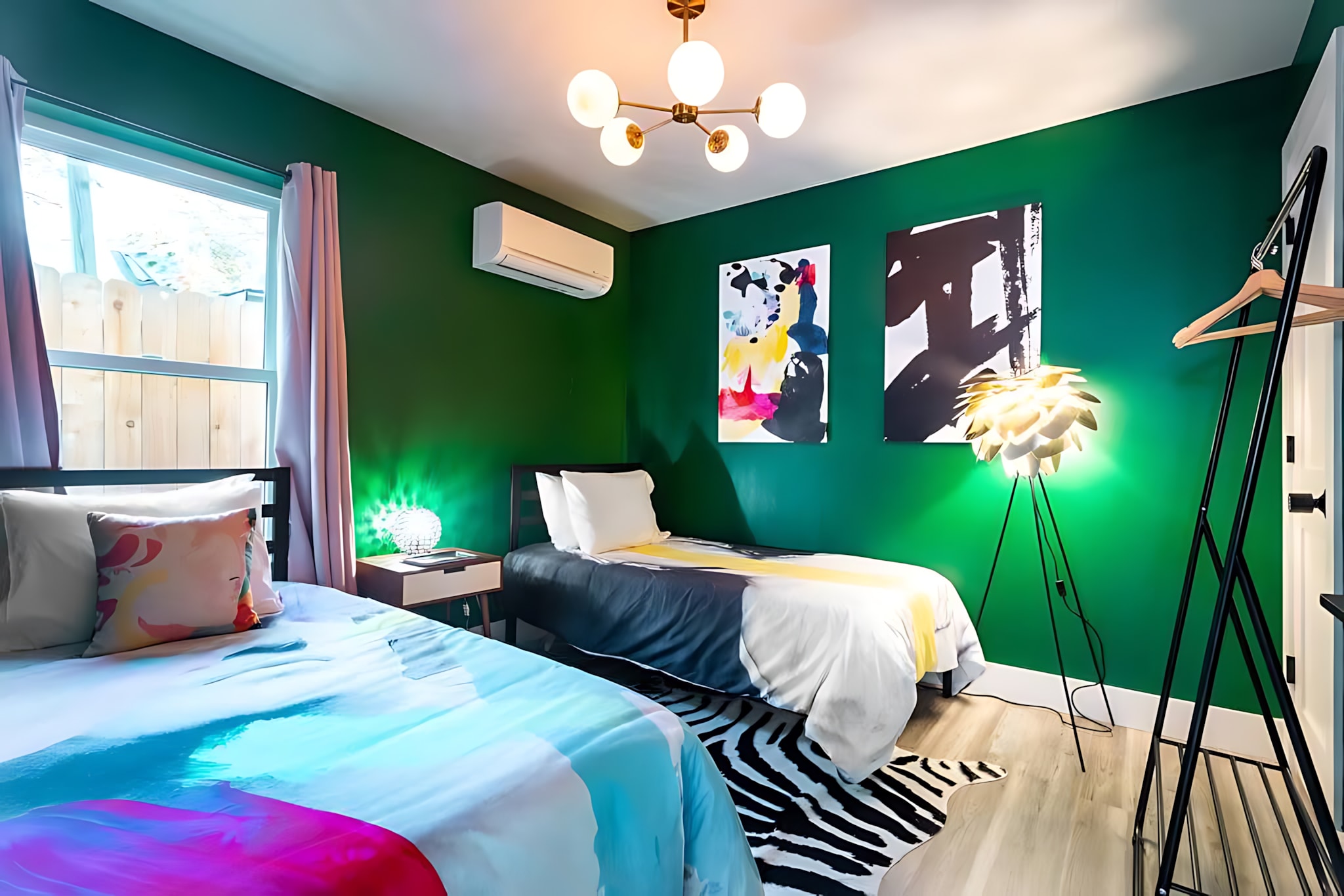 Cozy Bedroom With Twin Bed, Modern Art, And Vibrant Green Walls