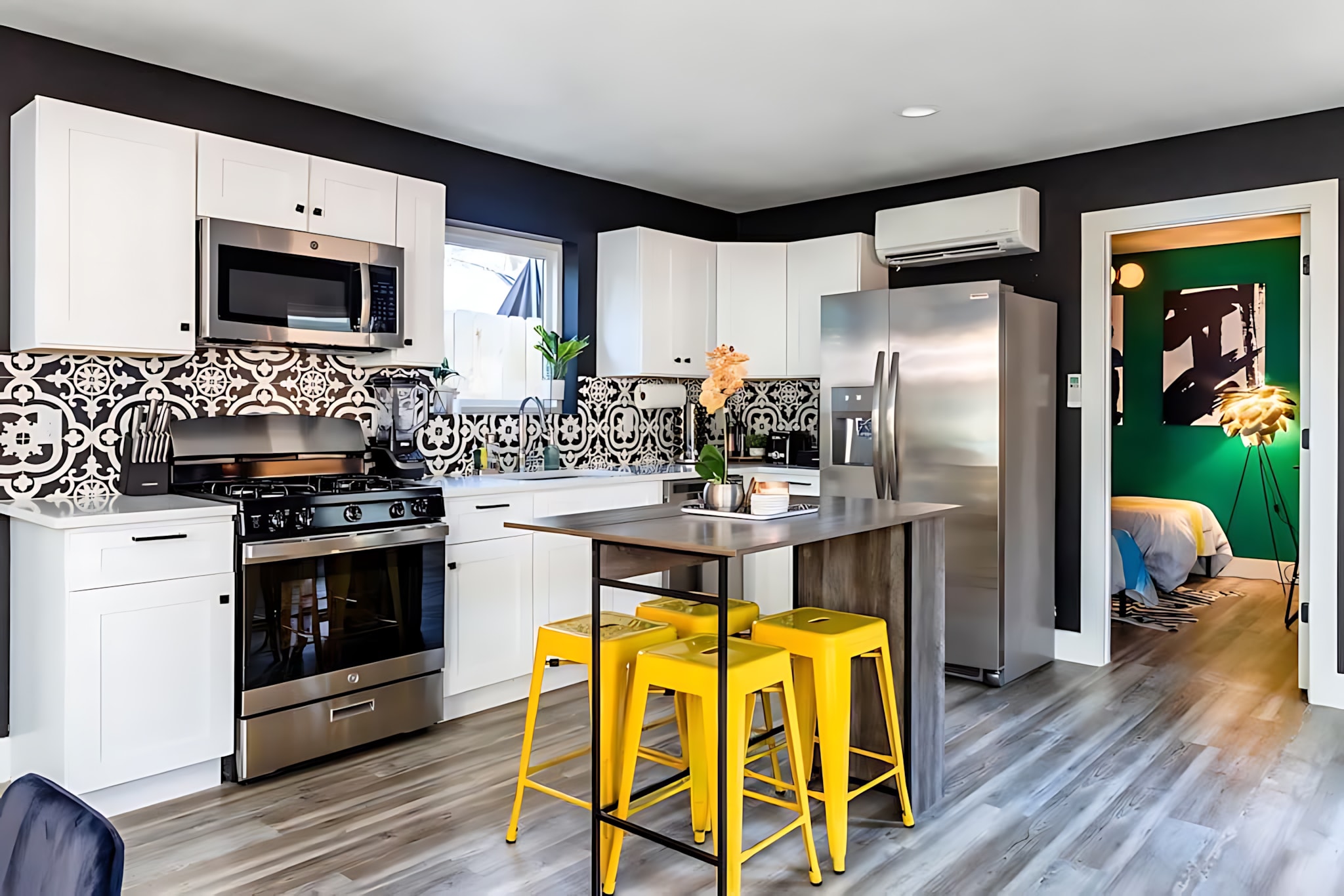 Modern Fully-Equipped Kitchen With Stylish Backsplash And Central Island