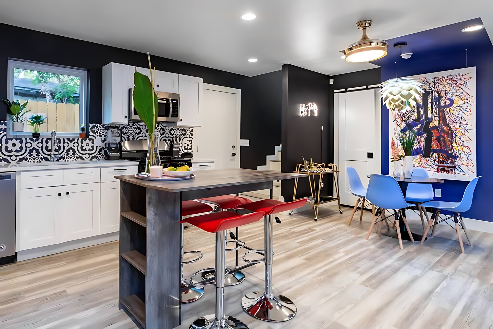Open Kitchen With Barstools And Dining Area