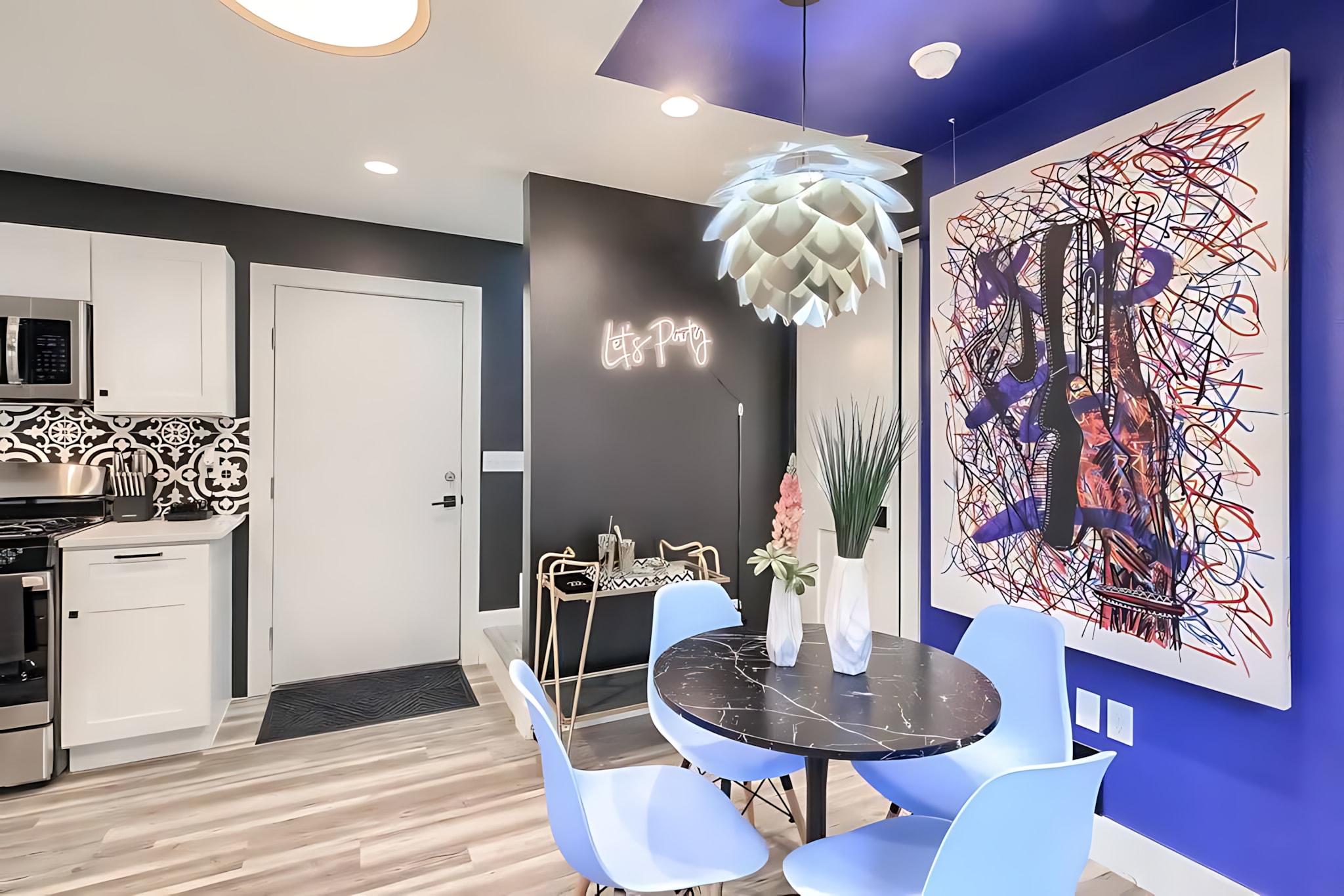 Modern Dining Area With Vibrant Artwork And Contemporary Design